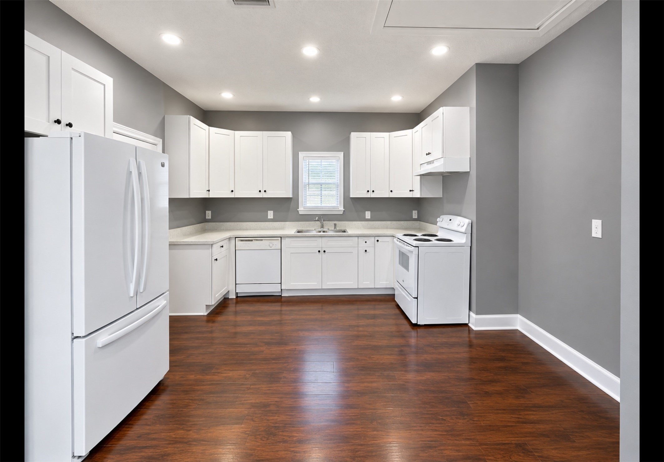Lots of cabinets and plenty of room for a portable island.
