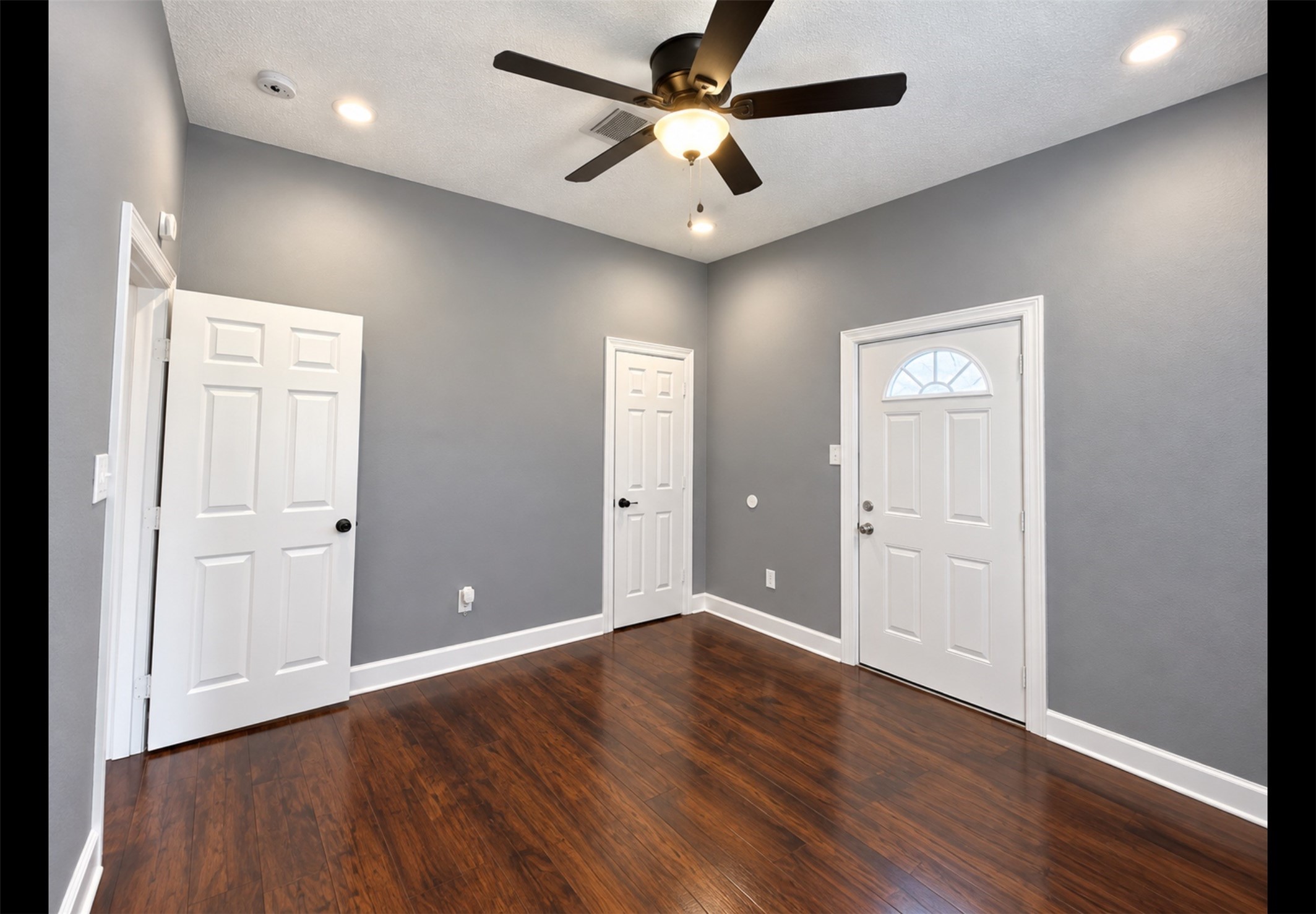 Large bedroom or game room that has access to the side yard and parking - perfect for roommates or older children.