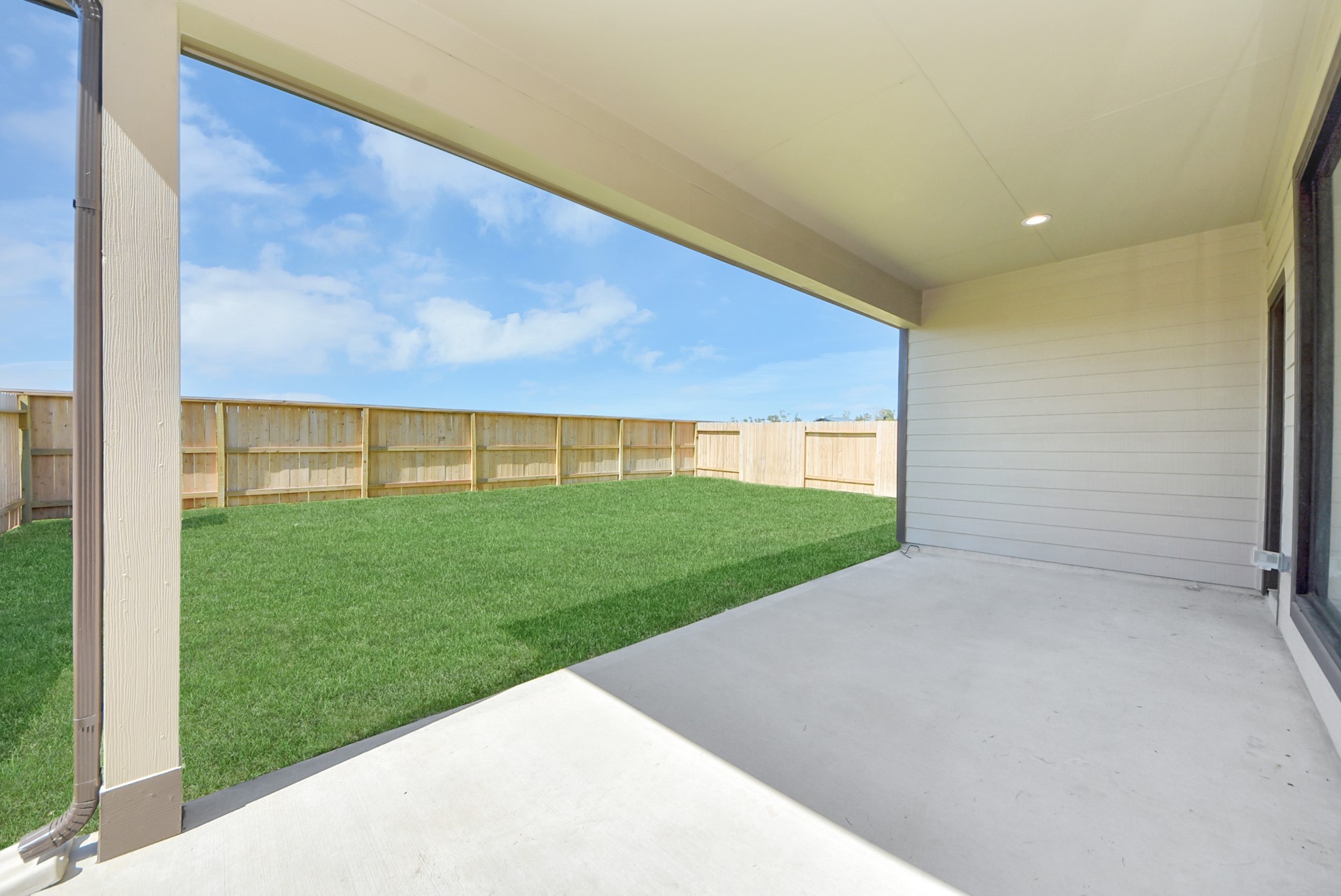 Come and see this spacious backyard with its beautiful covered patio. There is plenty of room for the kids to play and adults to relax. Perfect for your outdoor living space, patio furniture, bbq pit, and so much more. The possibilities are endless!