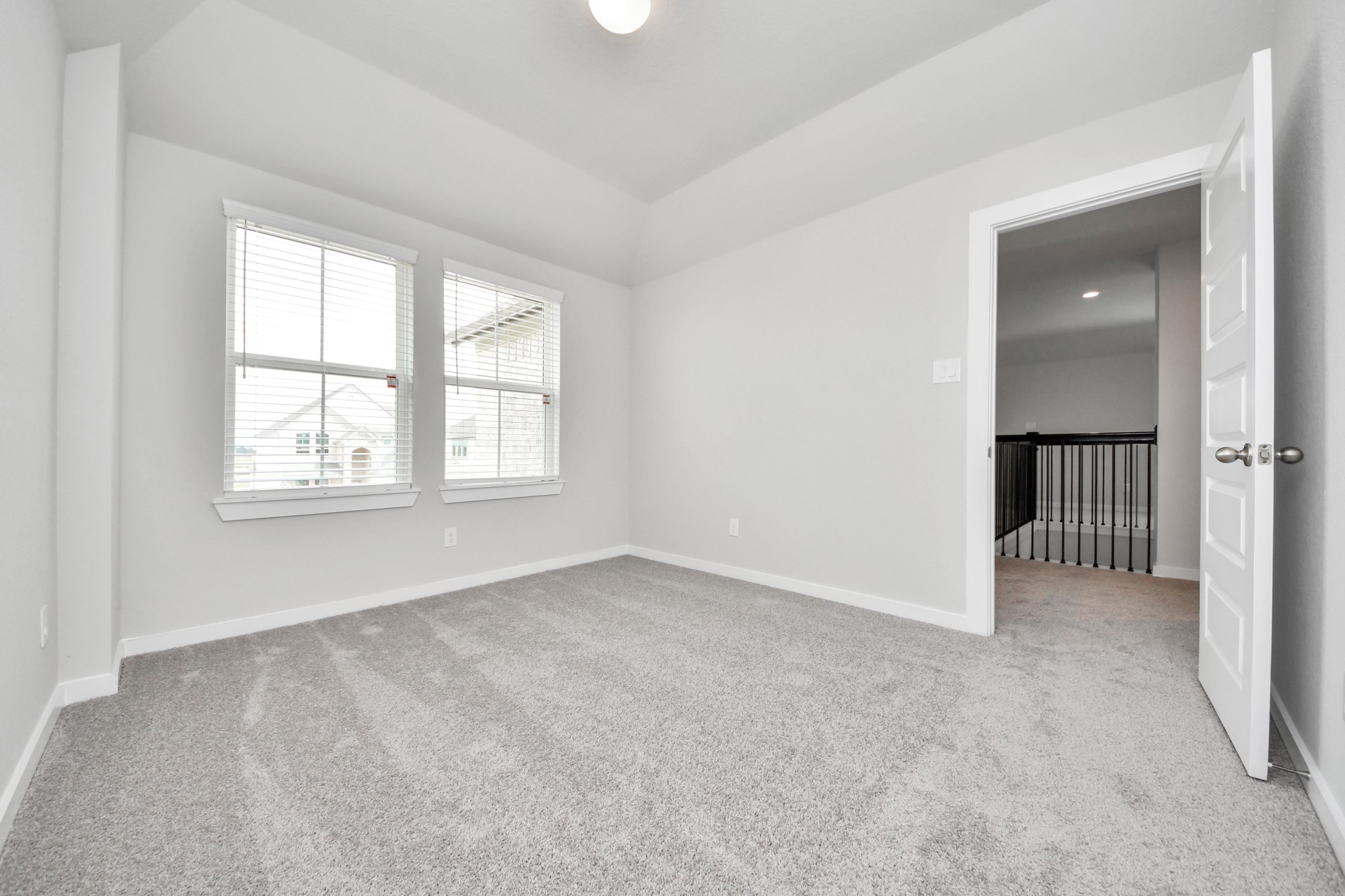 Generously sized secondary bedrooms featuring spacious closets, soft and inviting carpeting underfoot, large windows allowing plenty of natural light, and the added touch of privacy blinds for your personal retreat. Sample photo of completed home with similar floor plan. Actual colors and selections may vary.