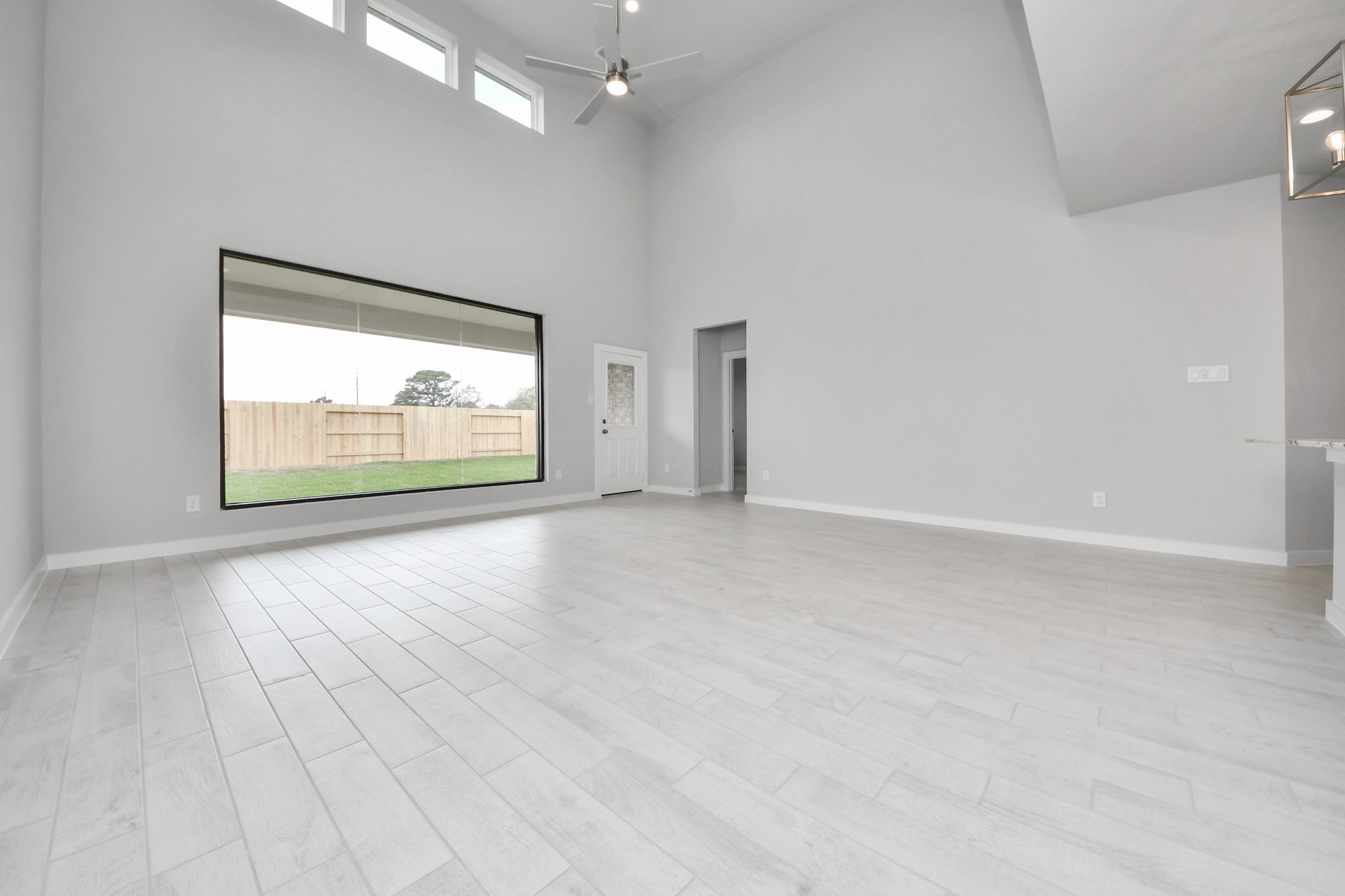 Take another glimpse into the heart of the home with this additional view of the family rooma sprawling space ready to accommodate all your gatherings. Sample photo of completed home with similar floor plan. Actual colors and selections may vary.