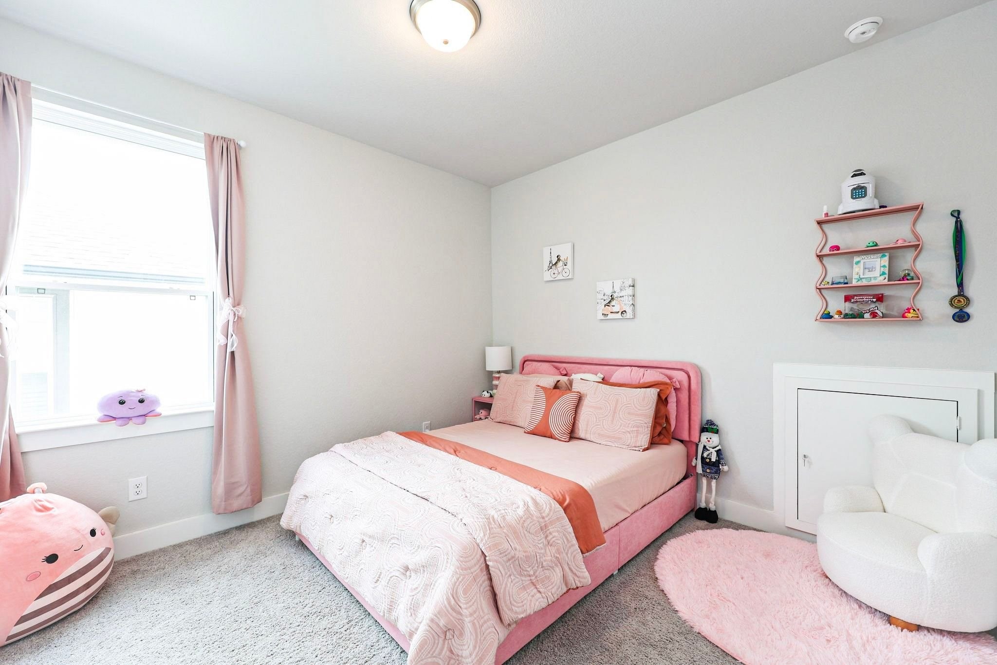 4th bedroom upstairs with large windows create an inviting atmosphere and room has access to attic crawl space to extra storage.