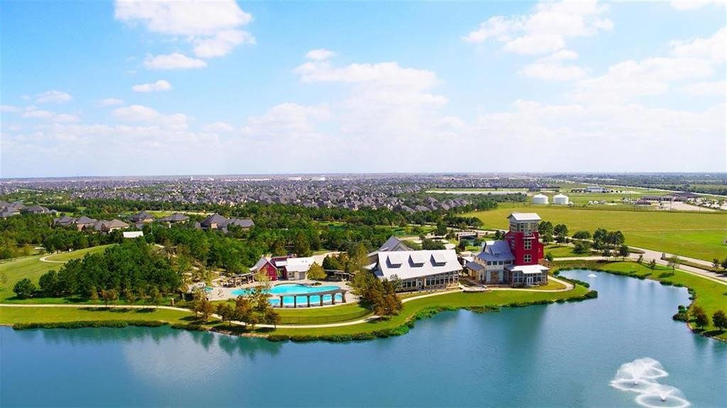 Experience serene lakeside living with beautiful community amenities, including a spacious pool, lush green spaces, and stunning waterfront views.