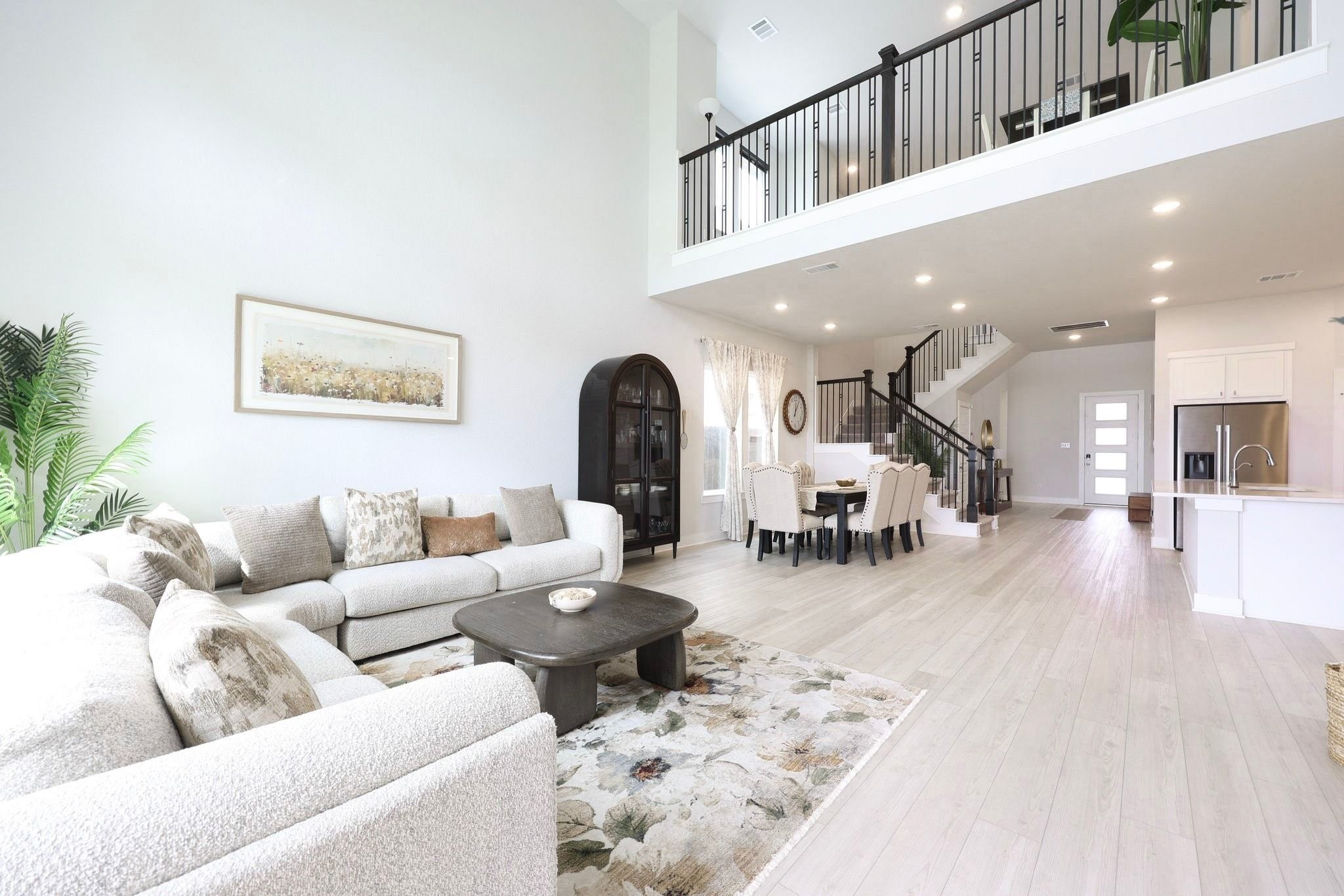 Spacious two story living area with a clear view of the game room give a grand look.