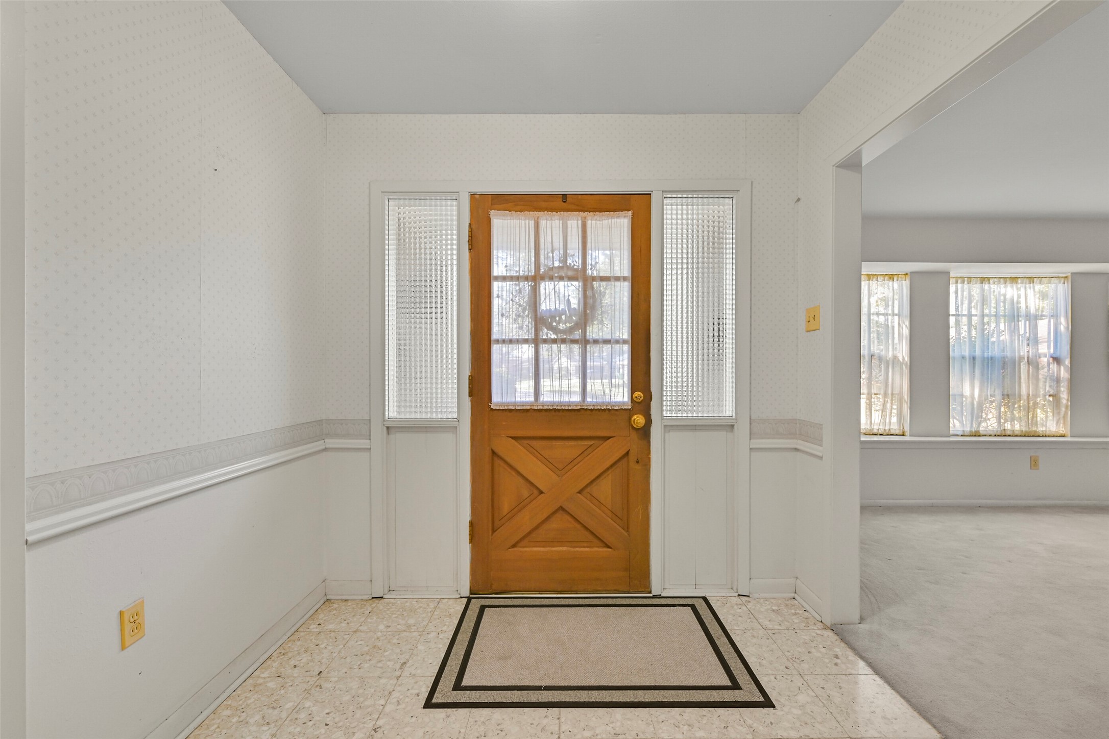 The entry way has terrazzo tile floors The entry way has terrazzo tile floors