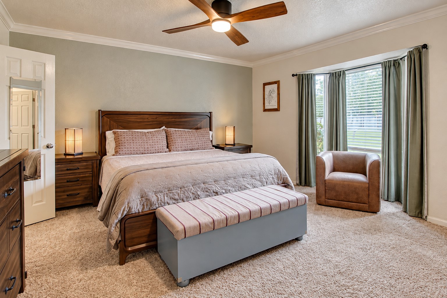 The bay window brings in plenty of natural light and adds a great character to the primary bedroom.