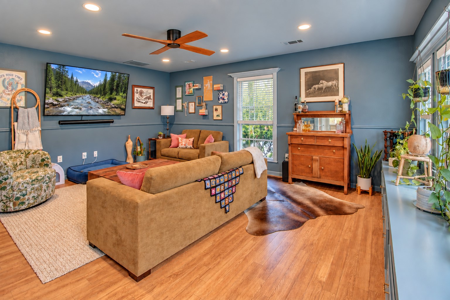 One of two sitting areas! This room is right inside the entrance on the side of the house. You will notice these beautiful fans continue throughout the home.