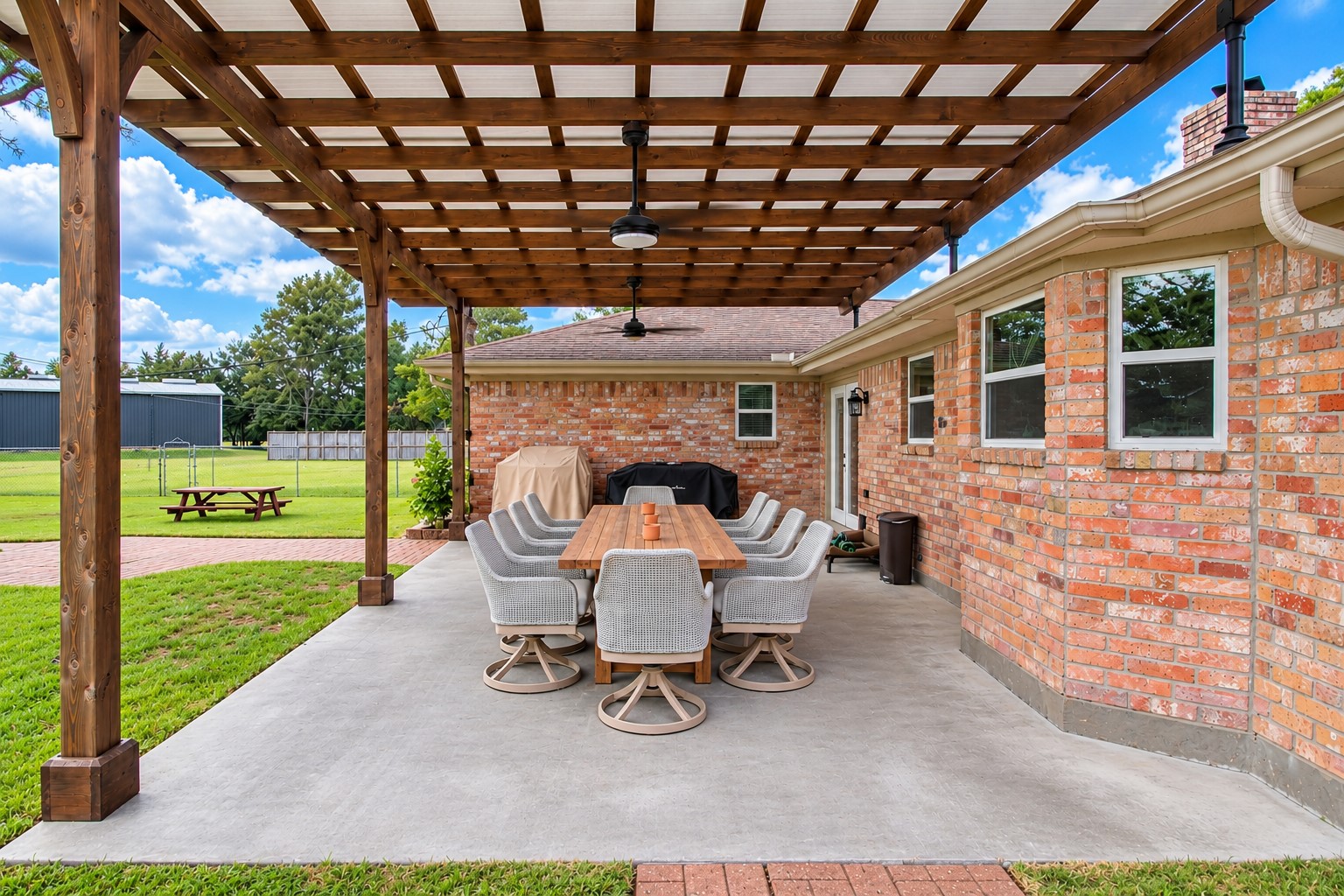 Picture yourself here with a cold glass of sweet tea or lemonade, enjoying long afternoons under the beautiful pergola!