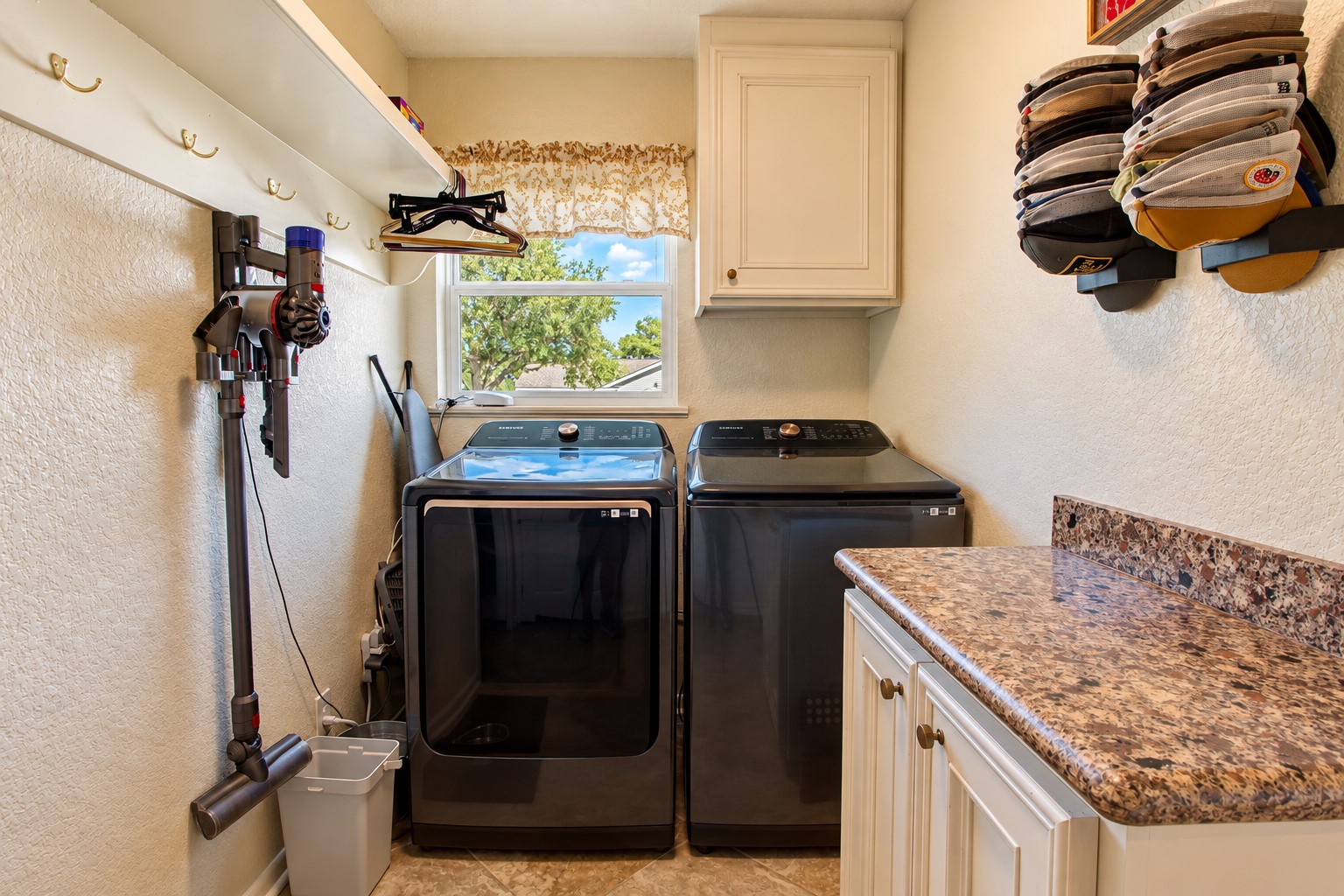 The laundry area separates the sitting area from the kitchen.