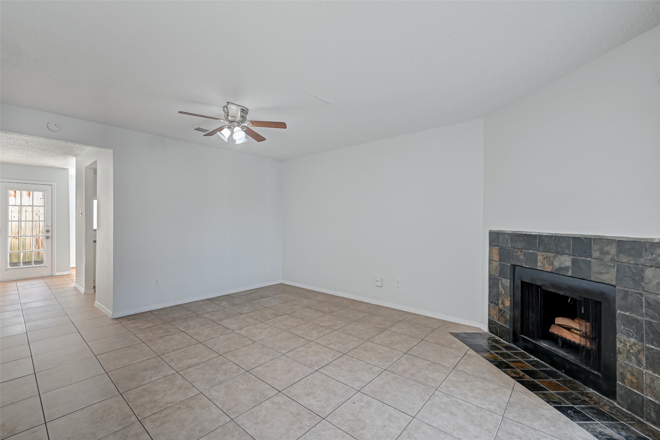 Living room with entry to kitchen and breakfast nook Living room with entry to kitchen and breakfast nook