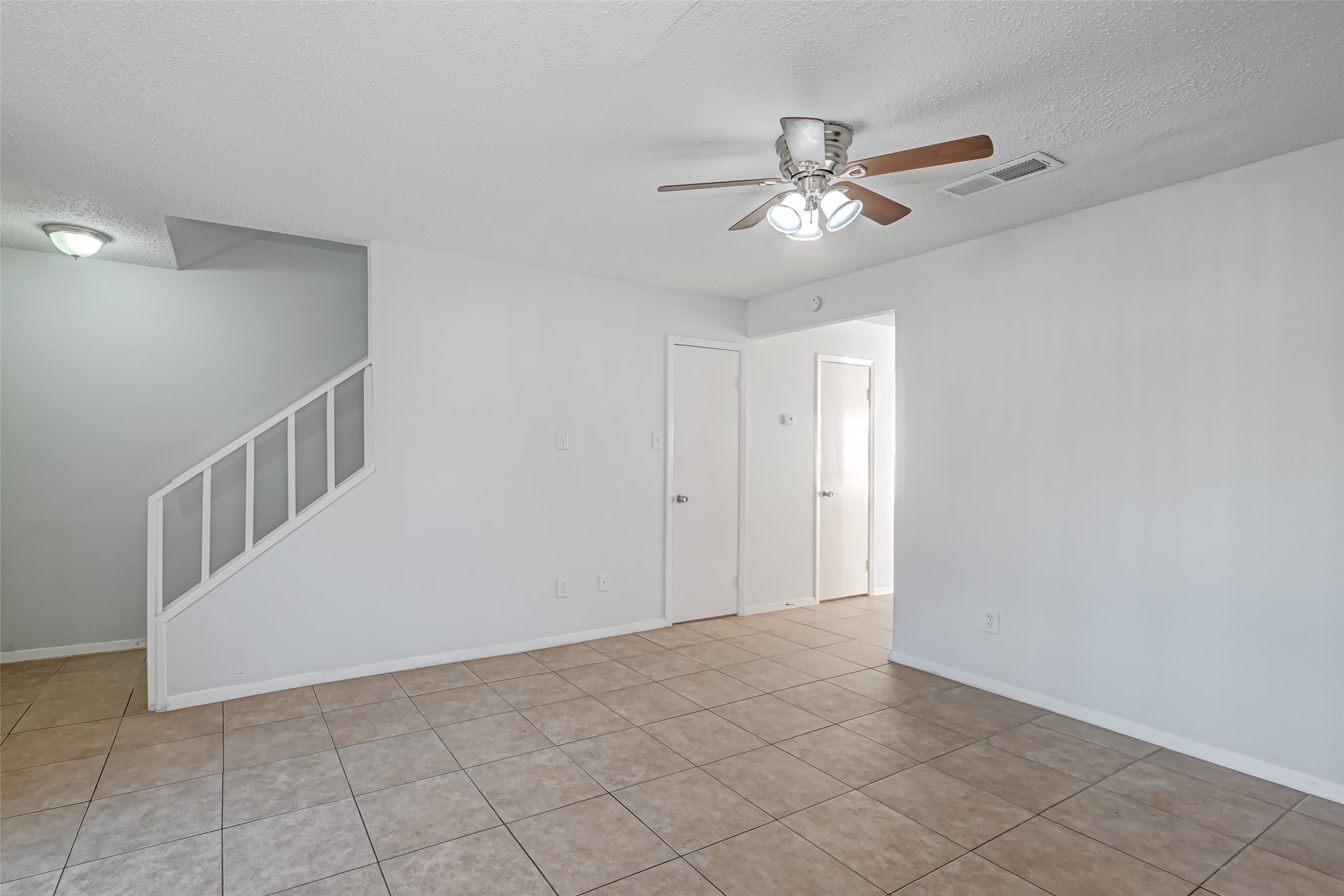 Living room with storage underneath the stairs Living room with storage underneath the stairs