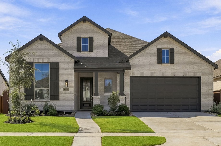 Classic curb appeal with a front porch.