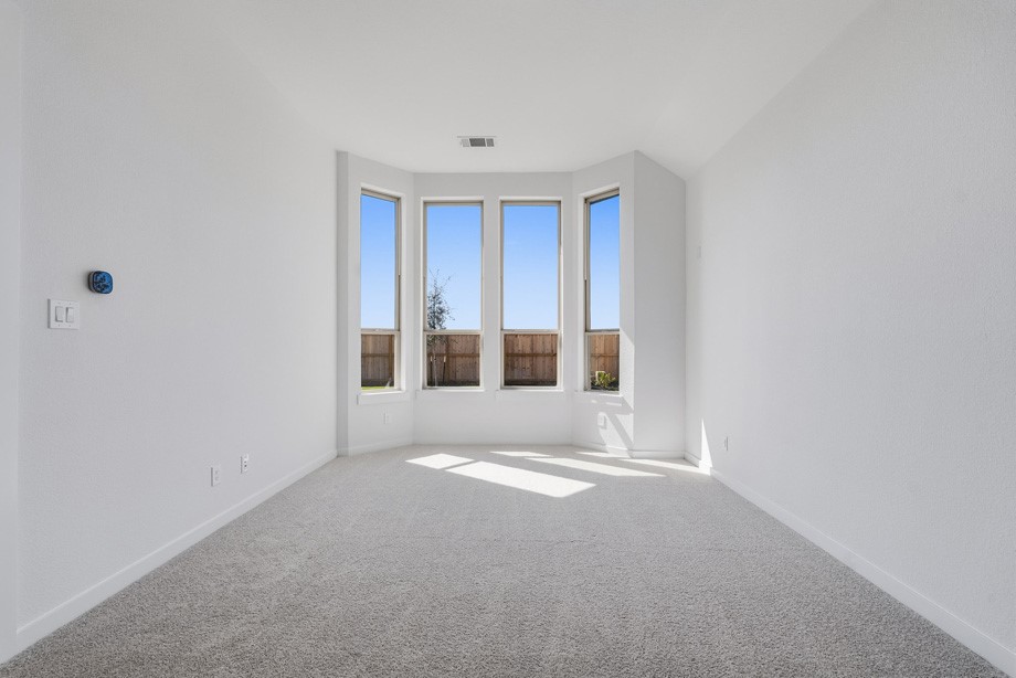 Bay window in the Primary provides extra space for sitting area.