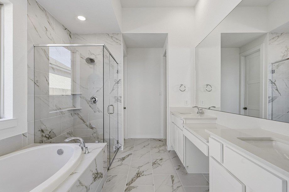 Primary bathroom features vanity area, perfect for getting ready.