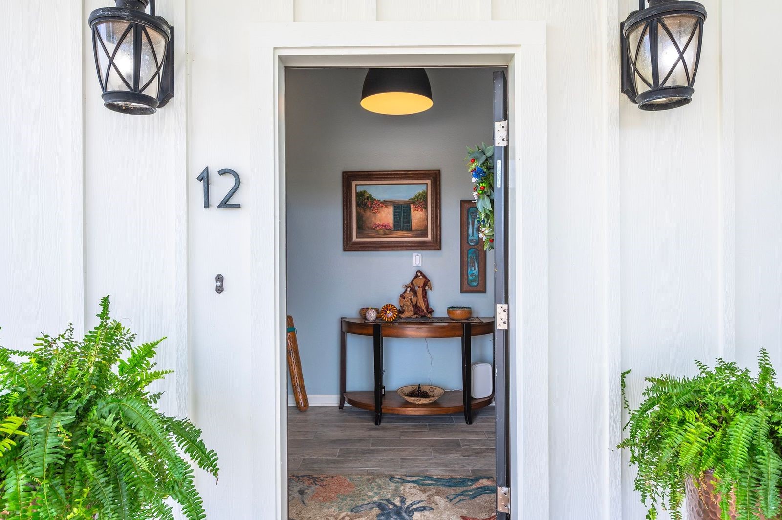 Easy Coastal-Style Living!  Inviting entrance featuring exterior coach lighting.