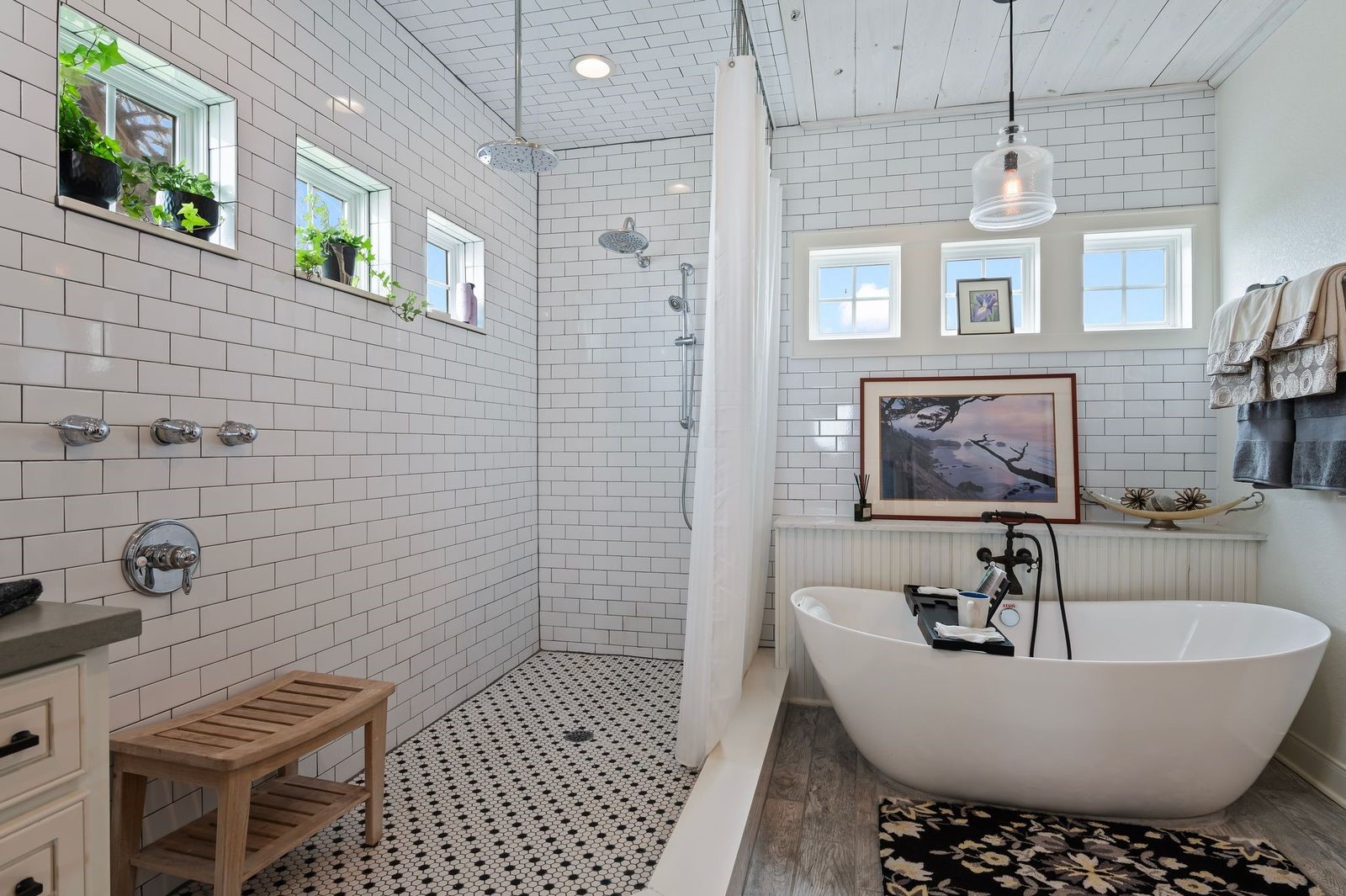 Beautiful, Modern & Spacious! Oversized custom walk-in shower with multiple body spray features and designer subway tile surrounding, or relax in the custom deep-soaking bathtub with upscale faucet.