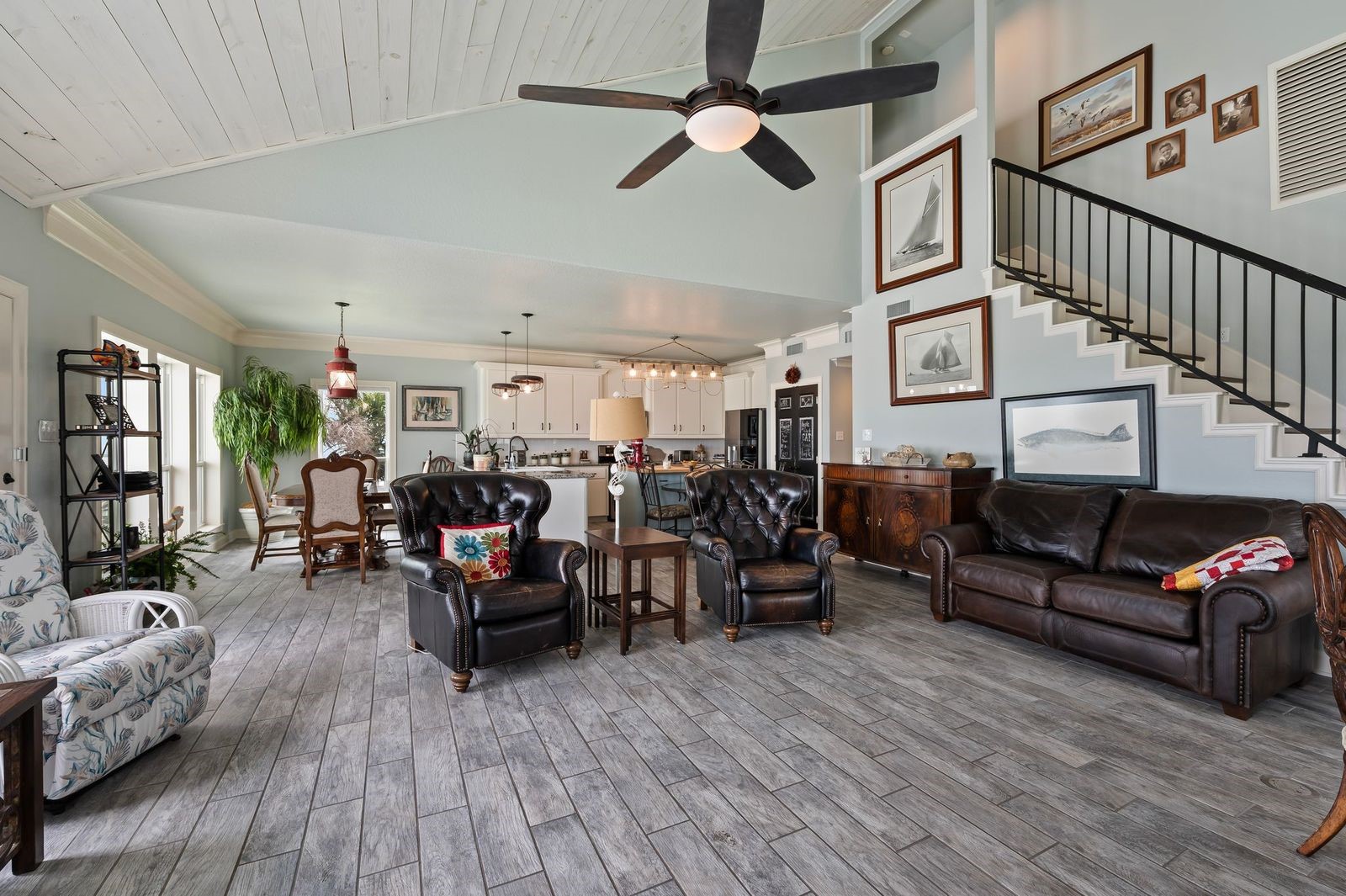 Stylish, Contemporary, Coastal Home! Large living space and open concept design with soaring cedar plank ceilings and cool coastal colors.
