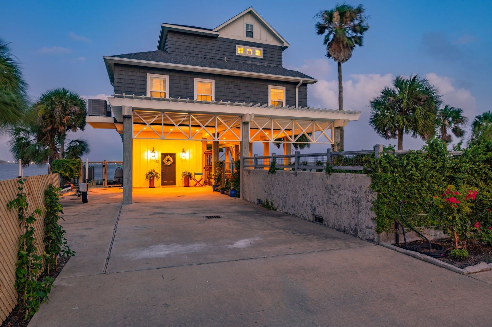 Coastal New England Style Design & Perfect Location! Lush landscaping with extended parking areas and outdoor lighting. Coastal New England Style Design & Perfect Location! Lush landscaping with extended parking areas and outdoor lighting.
