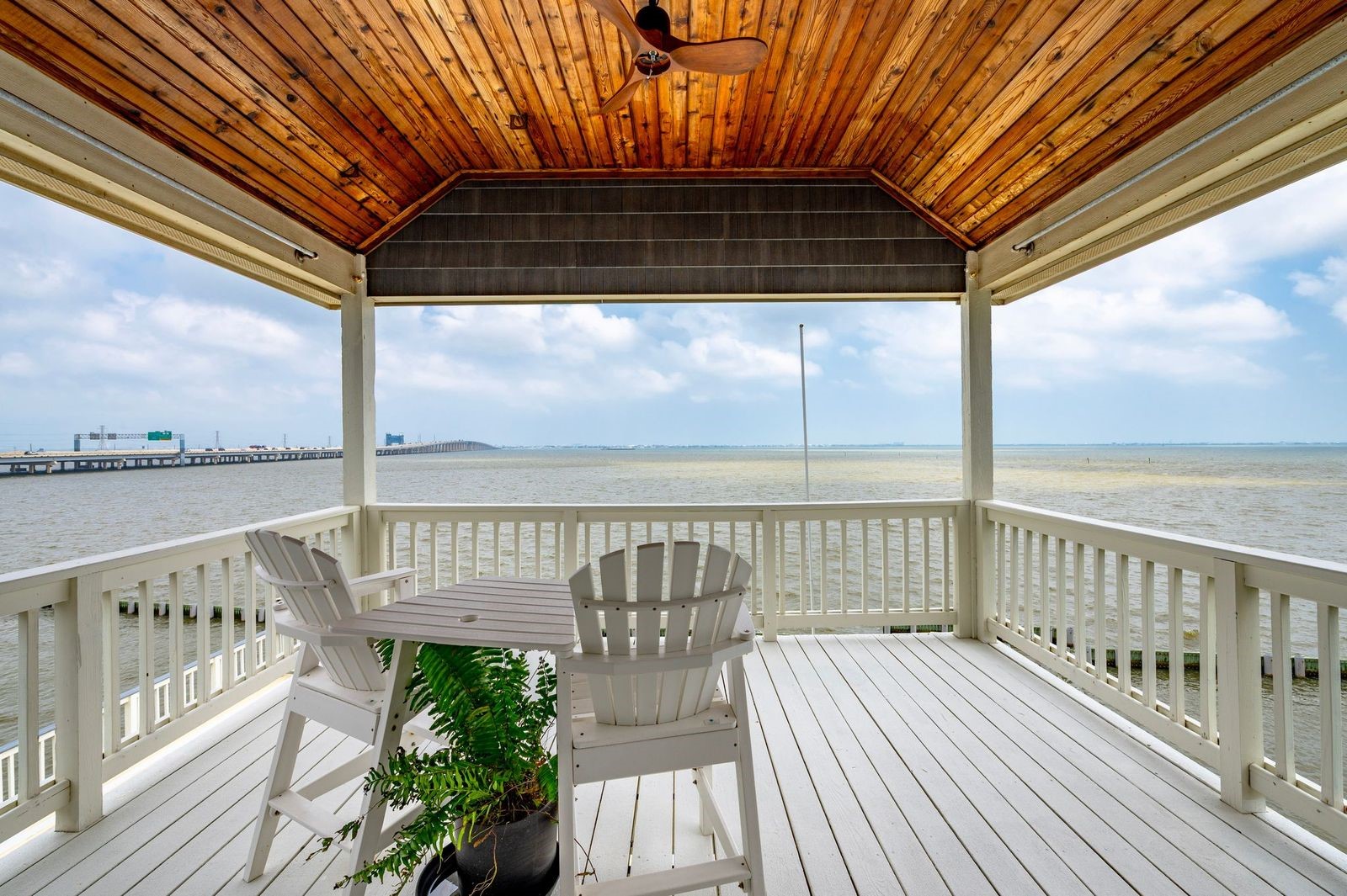 Views, Versatility and Value! Priceless views off the upper deck located off the primary bedroom featuring cedar plank accented ceiling and ceiling fan.