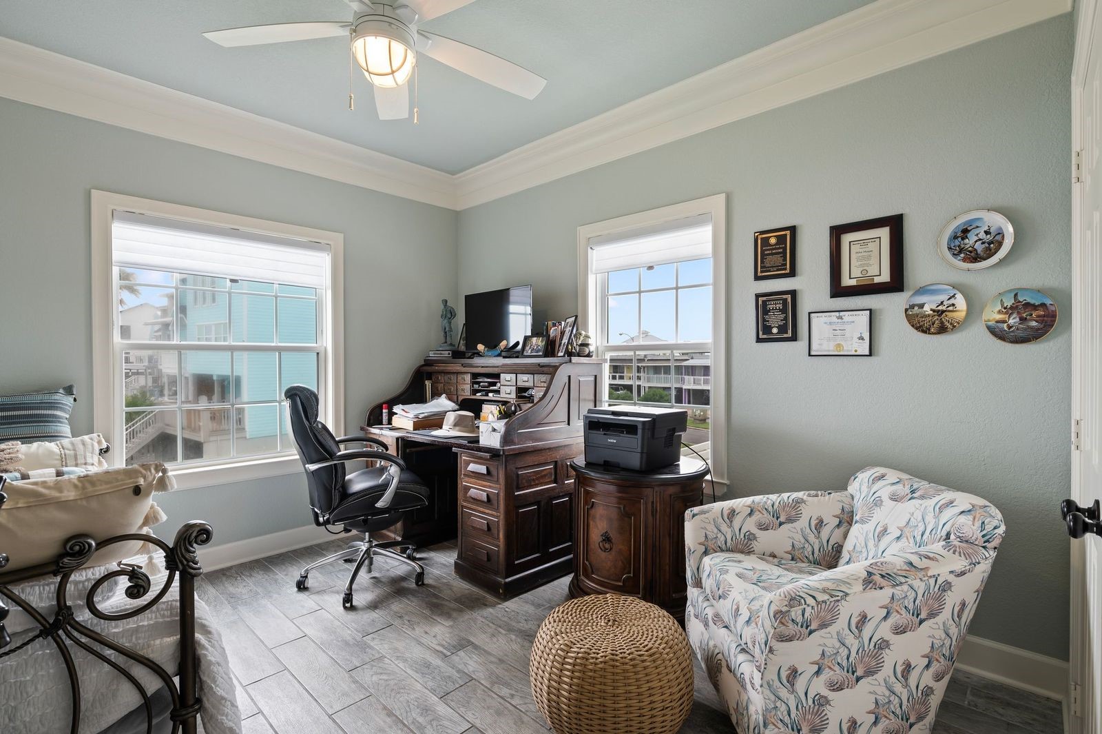 A Private Sanctuary For Everyone! Secondary bedroom with crown molding, coastal colors and tile flooring.