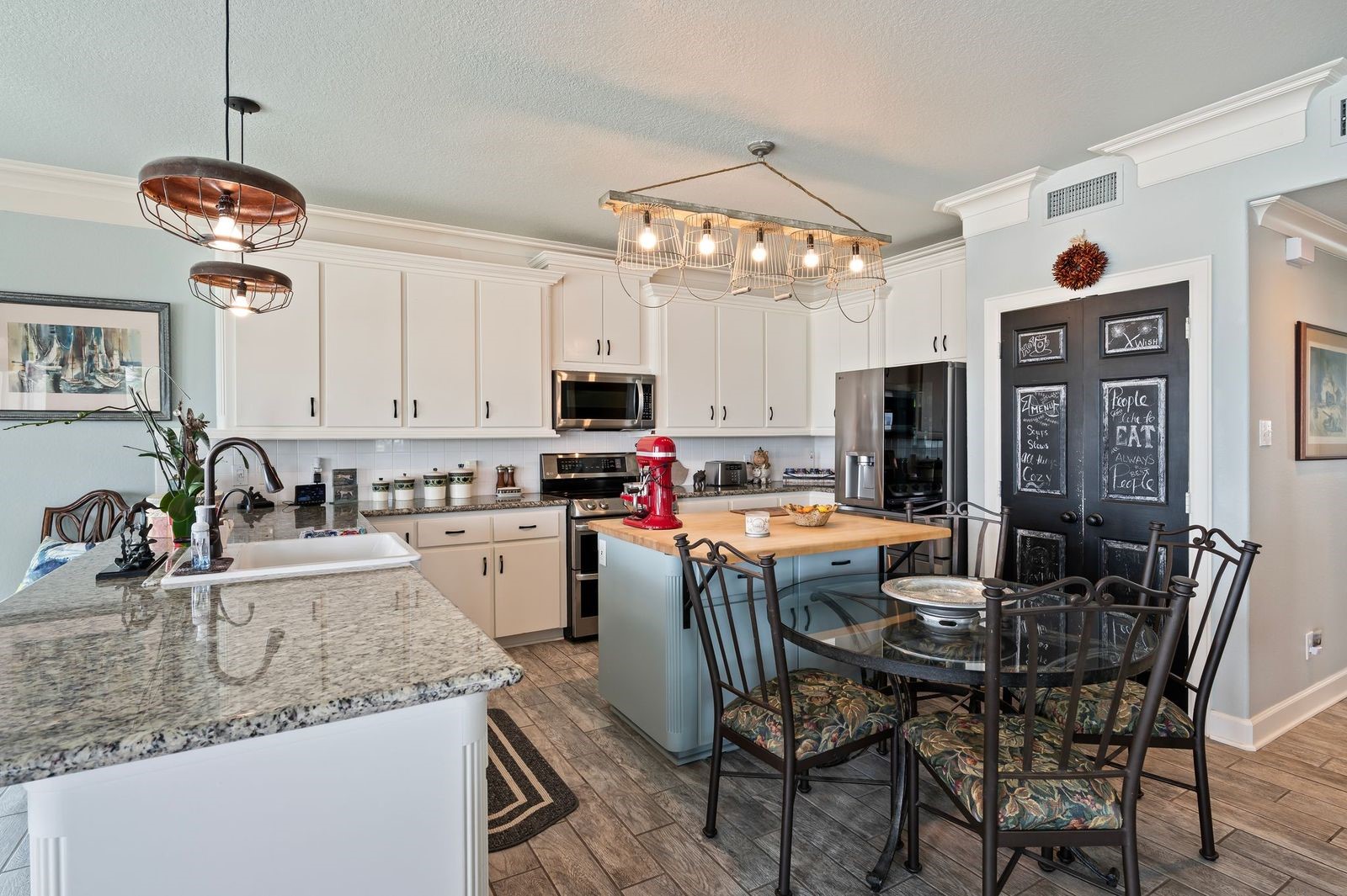 Spectacular, Stylish And Spacious!  Ample kitchen cabinet storage with stainless steel appliances with double oven, overhead microwave and dishwasher.