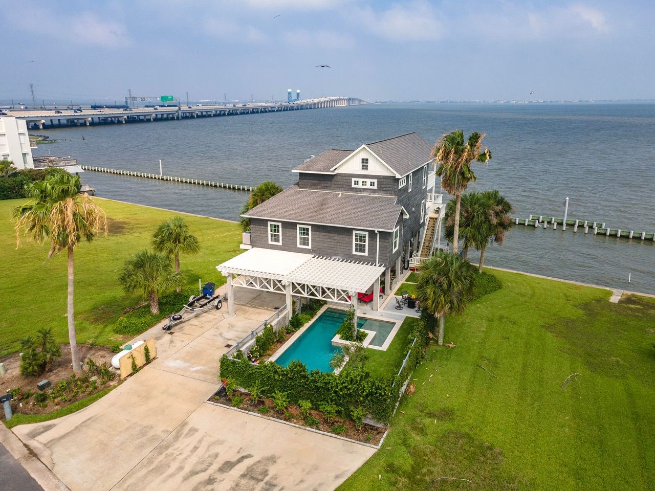 Ideally positioned in one of Tiki Island's most sought-after waterfront locations! Enjoy unparalleled privacy with no immediate neighbors on either side. Ideally positioned in one of Tiki Island's most sought-after waterfront locations! Enjoy unparalleled privacy with no immediate neighbors on either side.