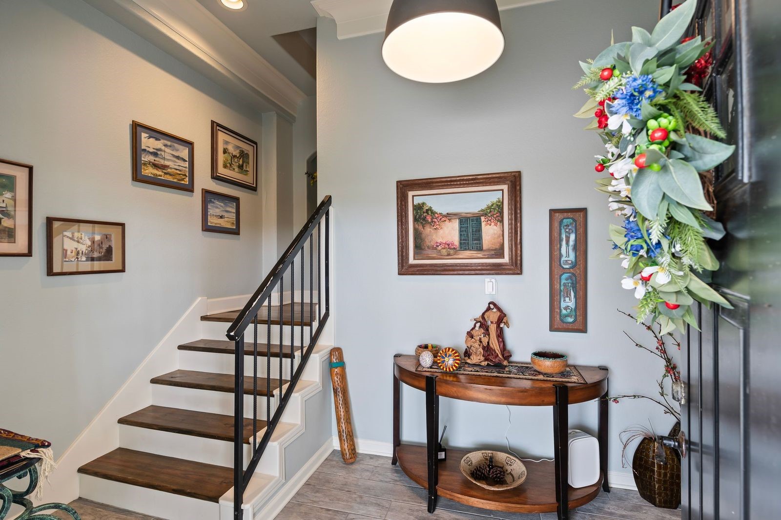 Timeless Elegance & Ambiance! Upon entering at ground level, you're greeted with cool coastal colors and rich hardwood floors.