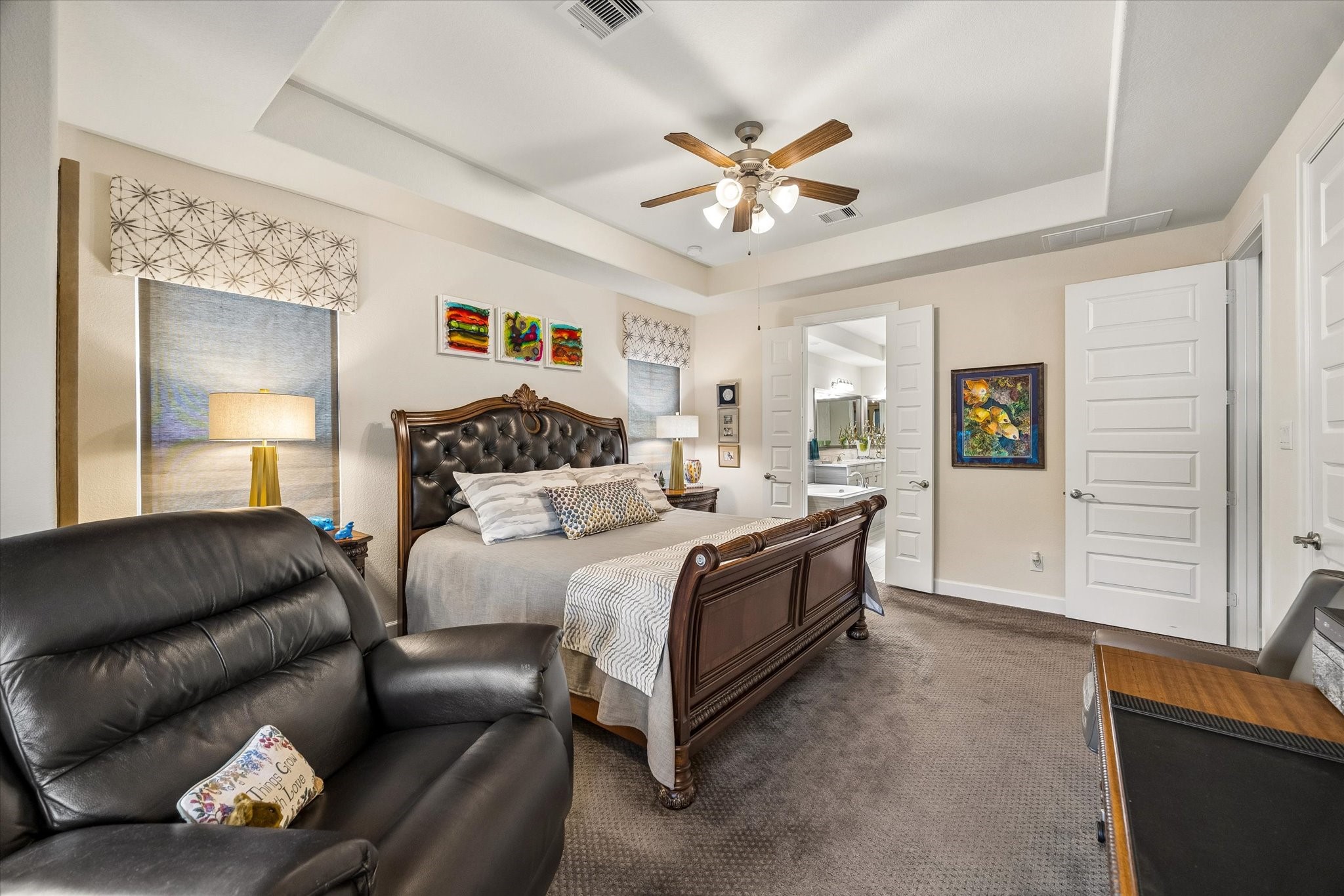 Majestic primary bedroom w/en-suite bathroom.