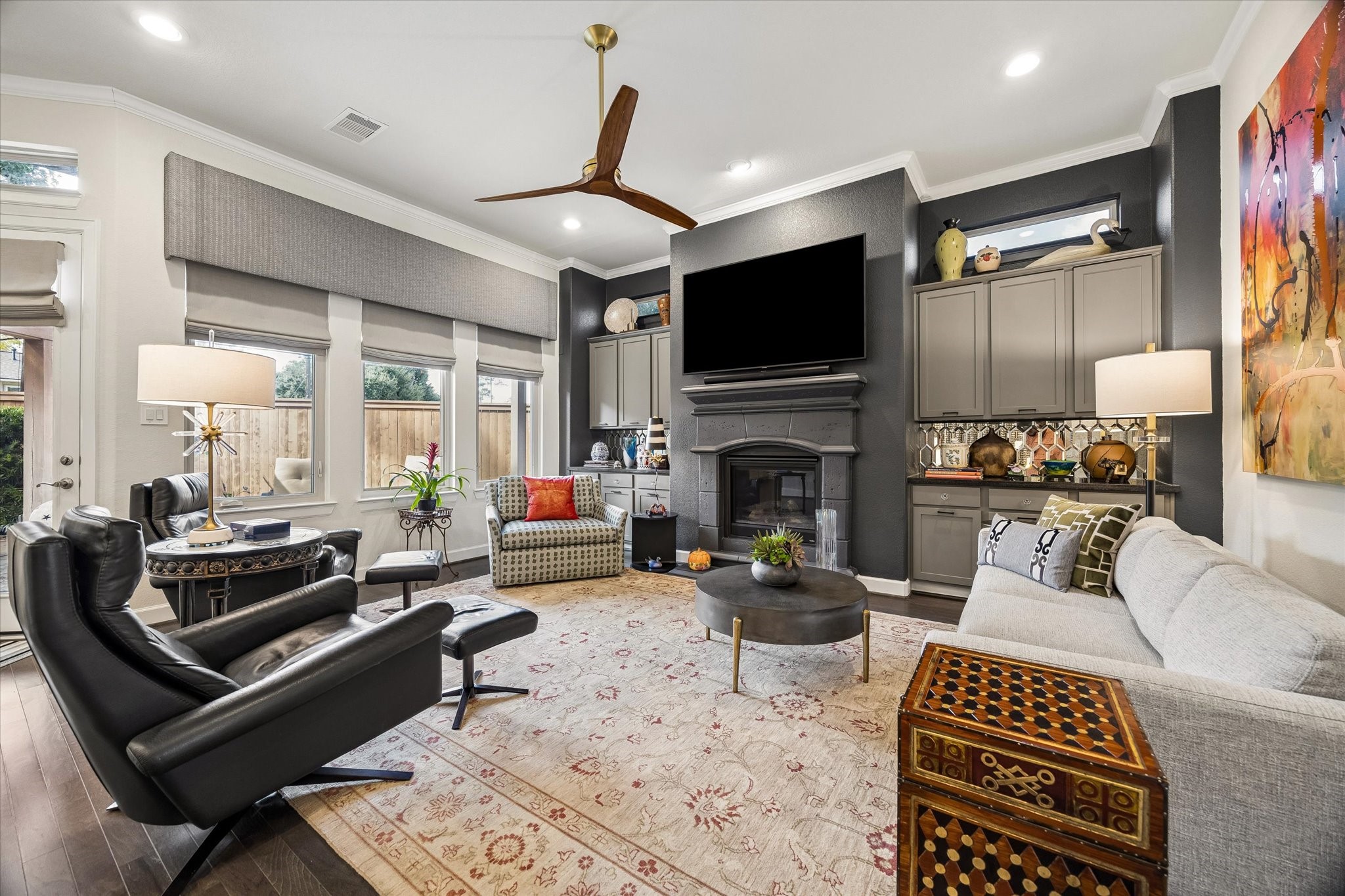 Spacious living room. fireplace w/side cabinets, electric shades.