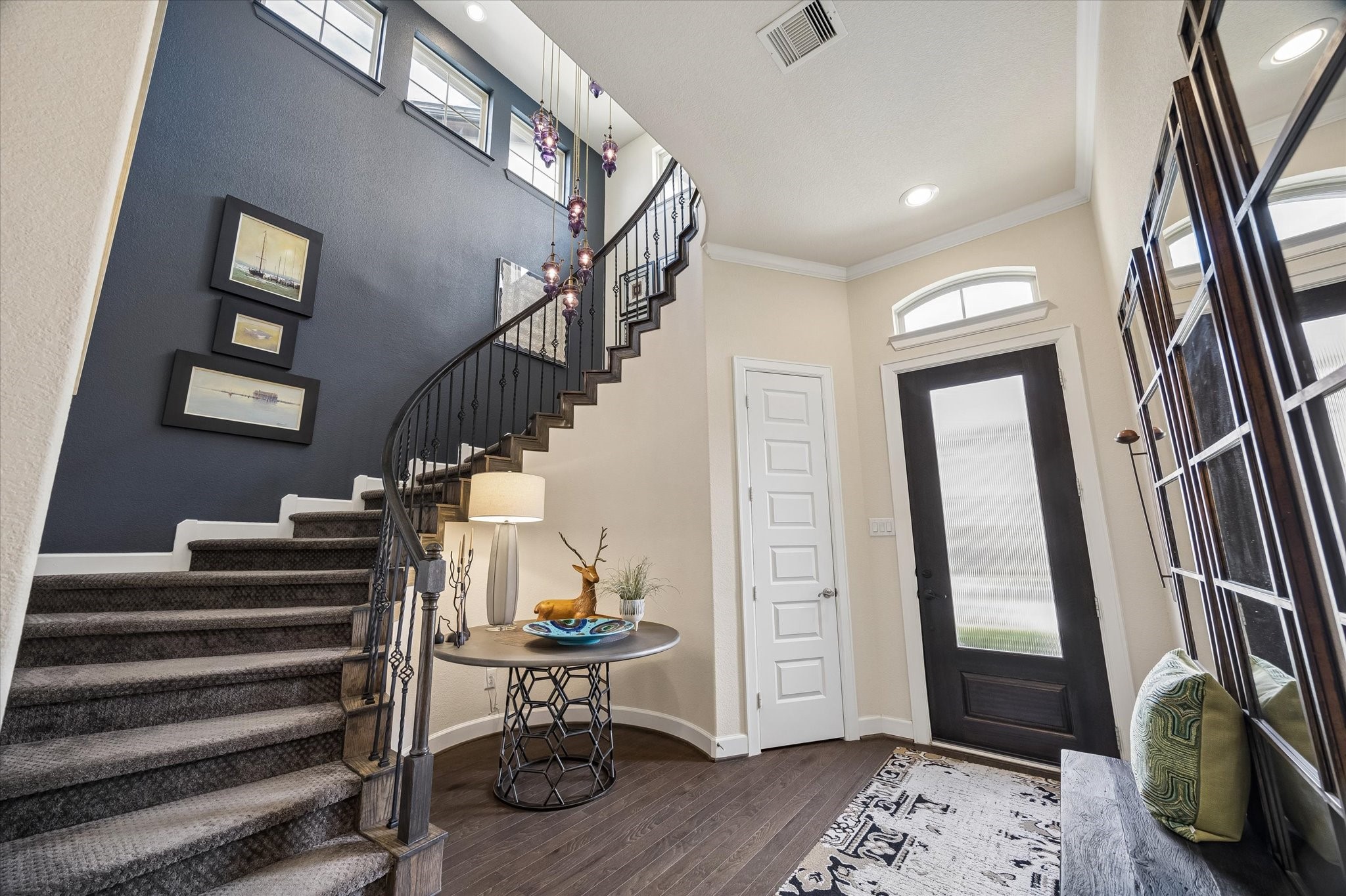 Dramatic Entry Foyer w/spiral staircase. Open & bright