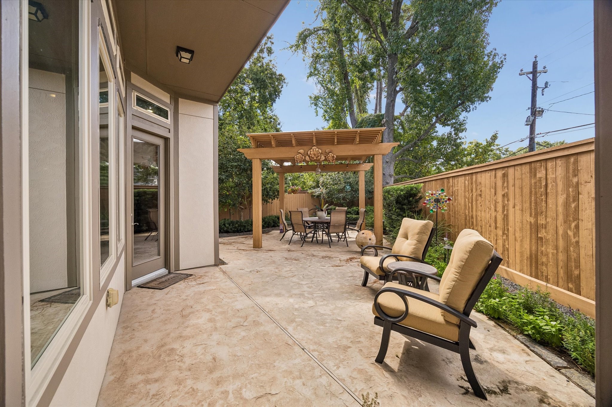 Oversized yard. Perfect for relaxing or entertaining. Beautifully landscaped with covered pergola.