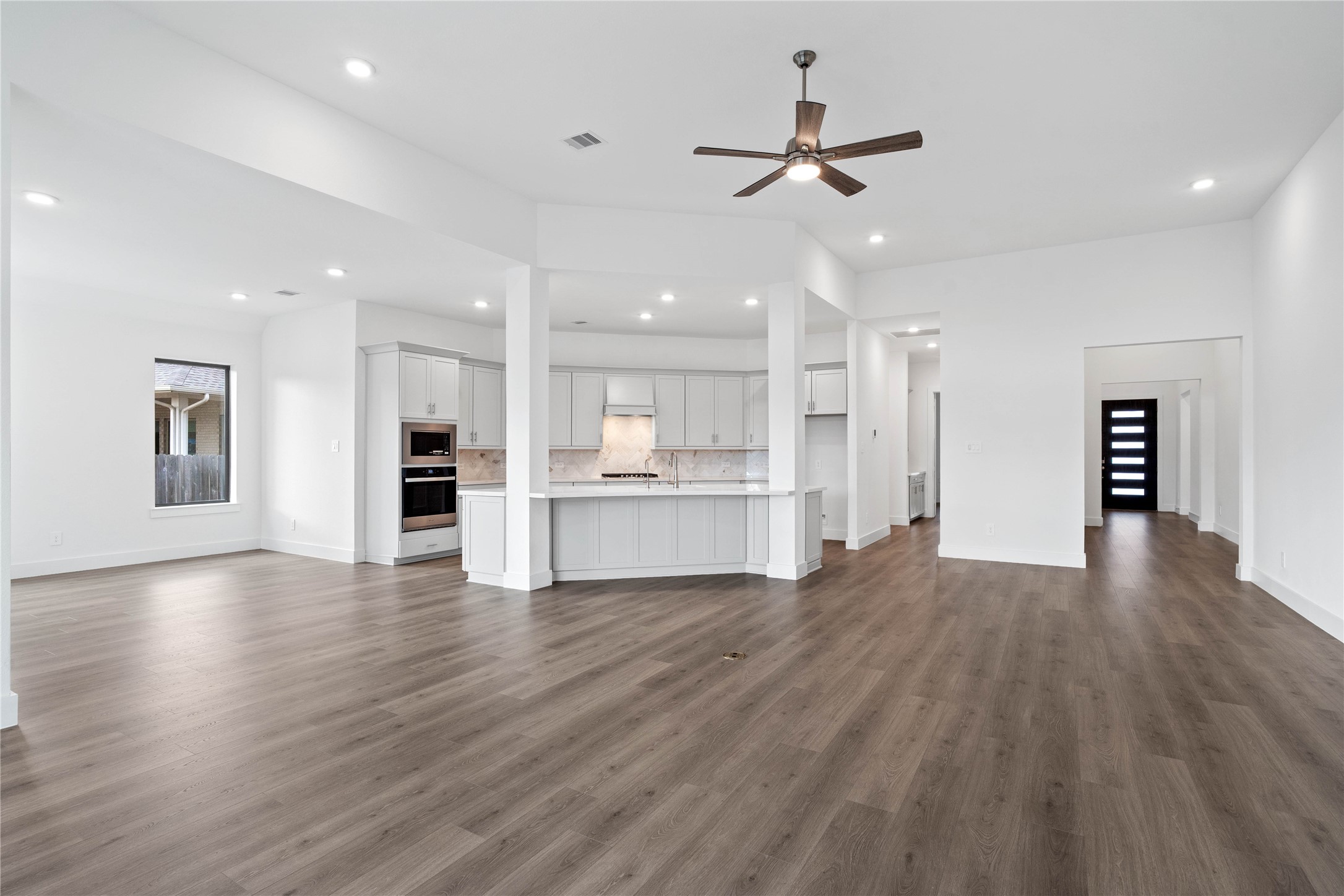 Whether you are relaxing in the great room or greeting guests at the front door, the open sightlines ensure that everyone feels connected, fostering a truly inclusive living experience where isolation is a thing of the past.