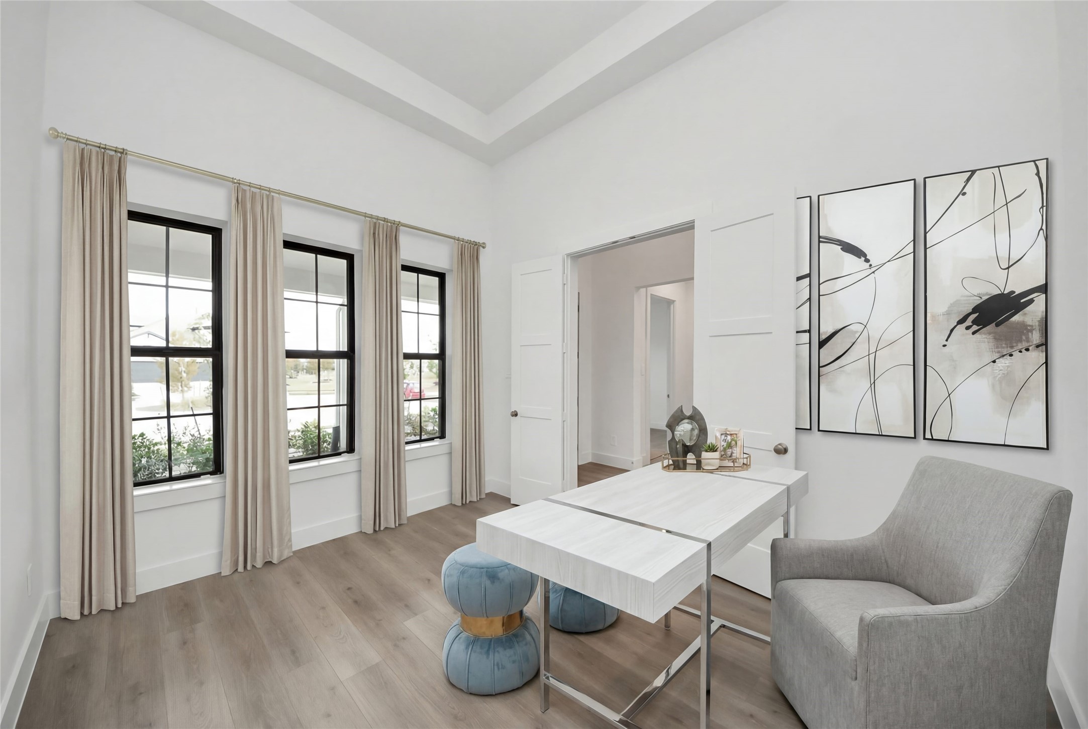 This handsome Study features laminate flooring, large windows, tray ceiling, lighting, custom paint, and double doors for privacy.