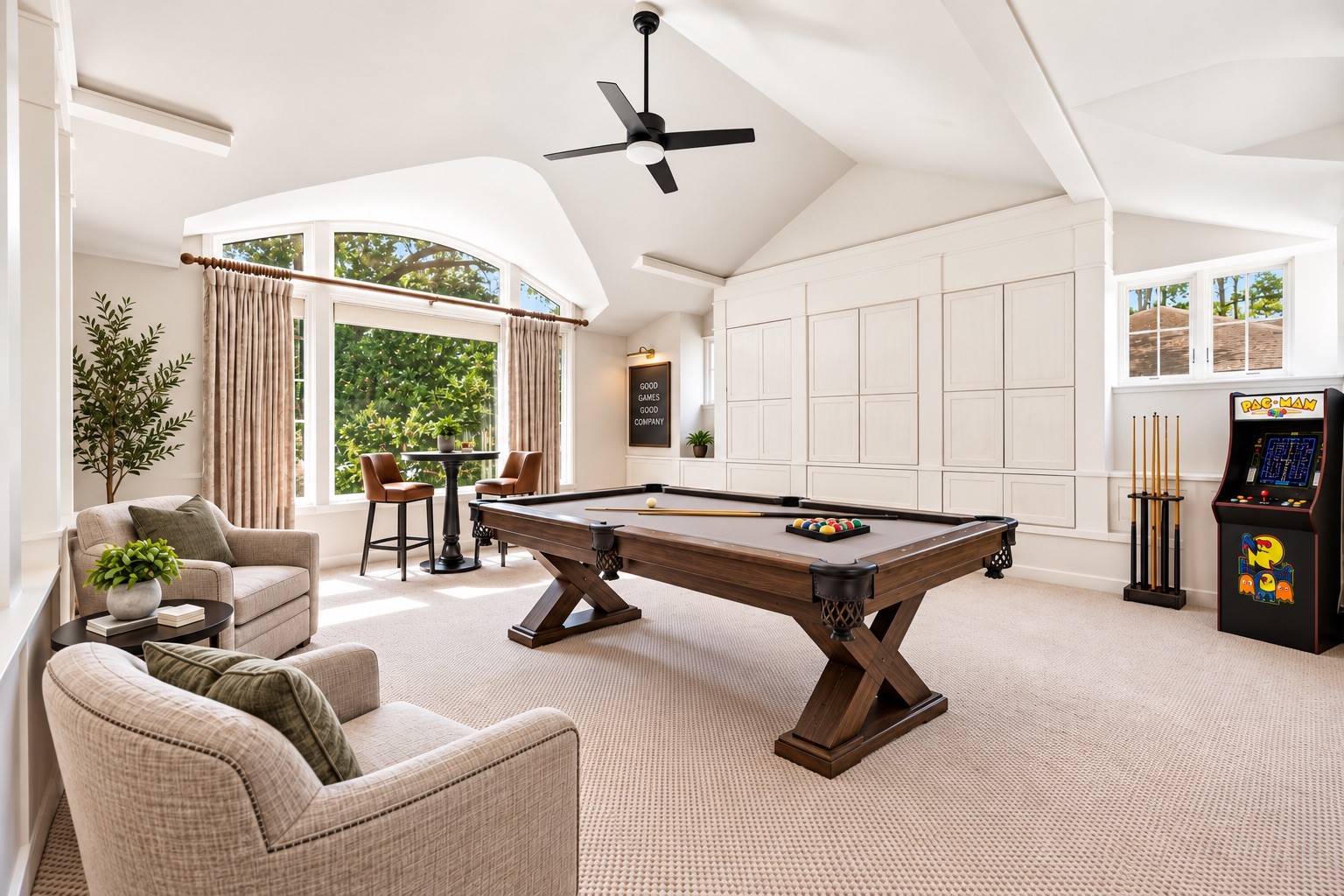 Fabulous game room with high ceilings, fireplace, versatile built-in storage, and plush carpet.* virtually staged*