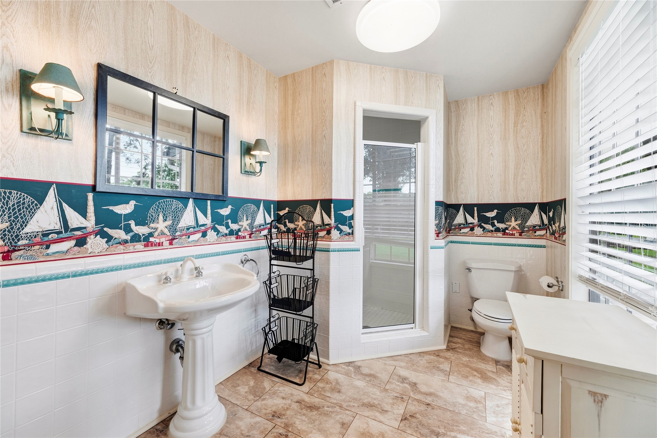 Full bathroom accessible from the backyard - perfect for hosting at the pool and lake.