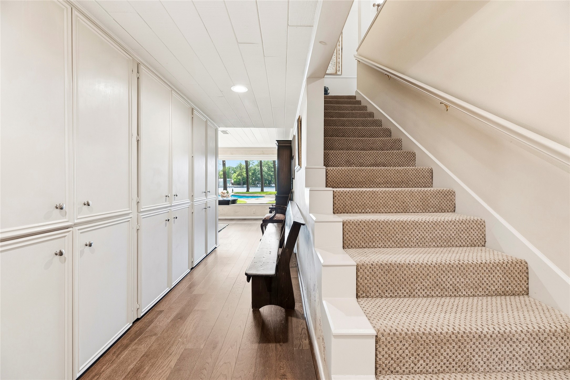 Second staircase leading directly up to the game room or down the hall to the heart of the home.