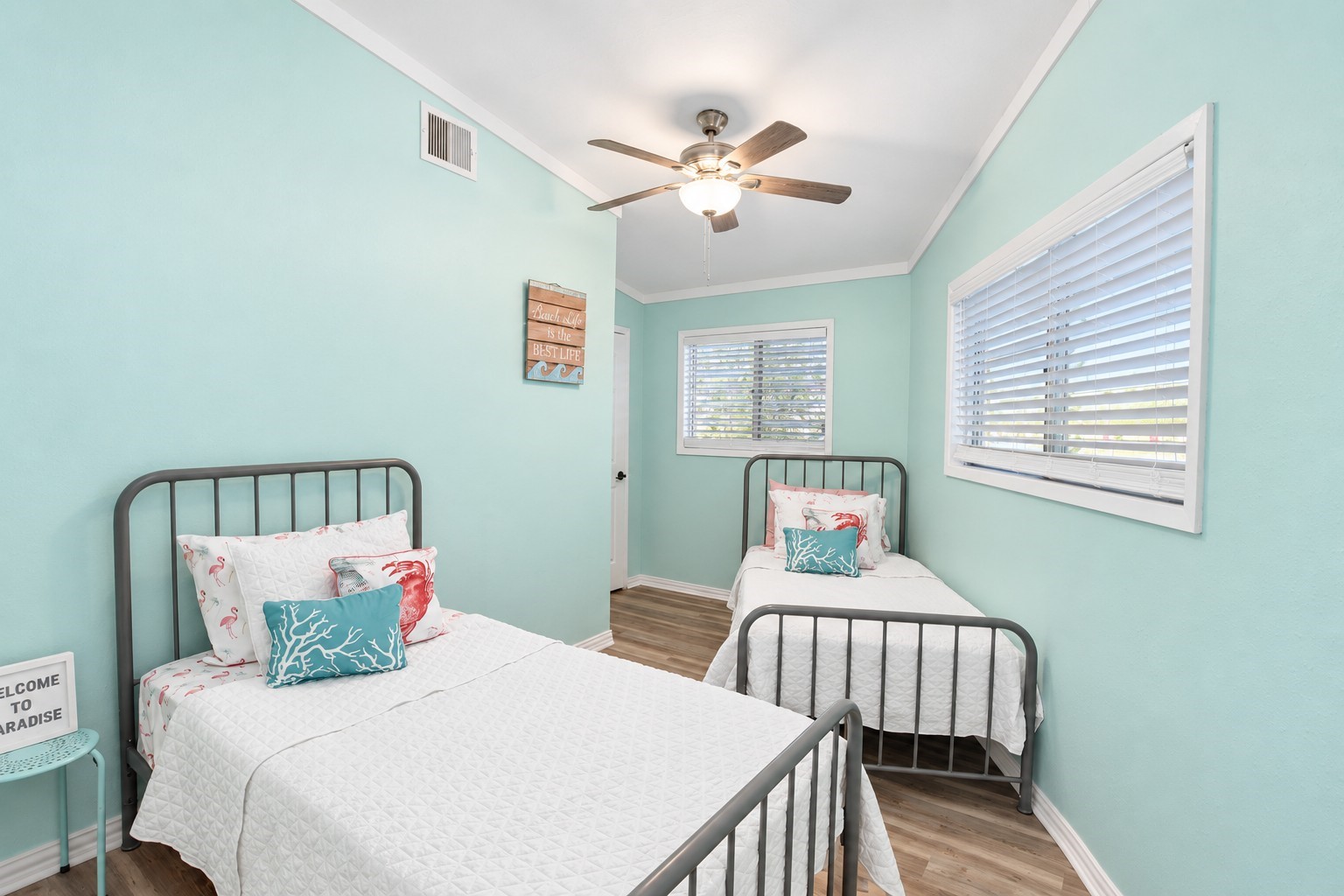 This back bedroom over looking driveway has a unqie shape but large enough for 2 twin beds