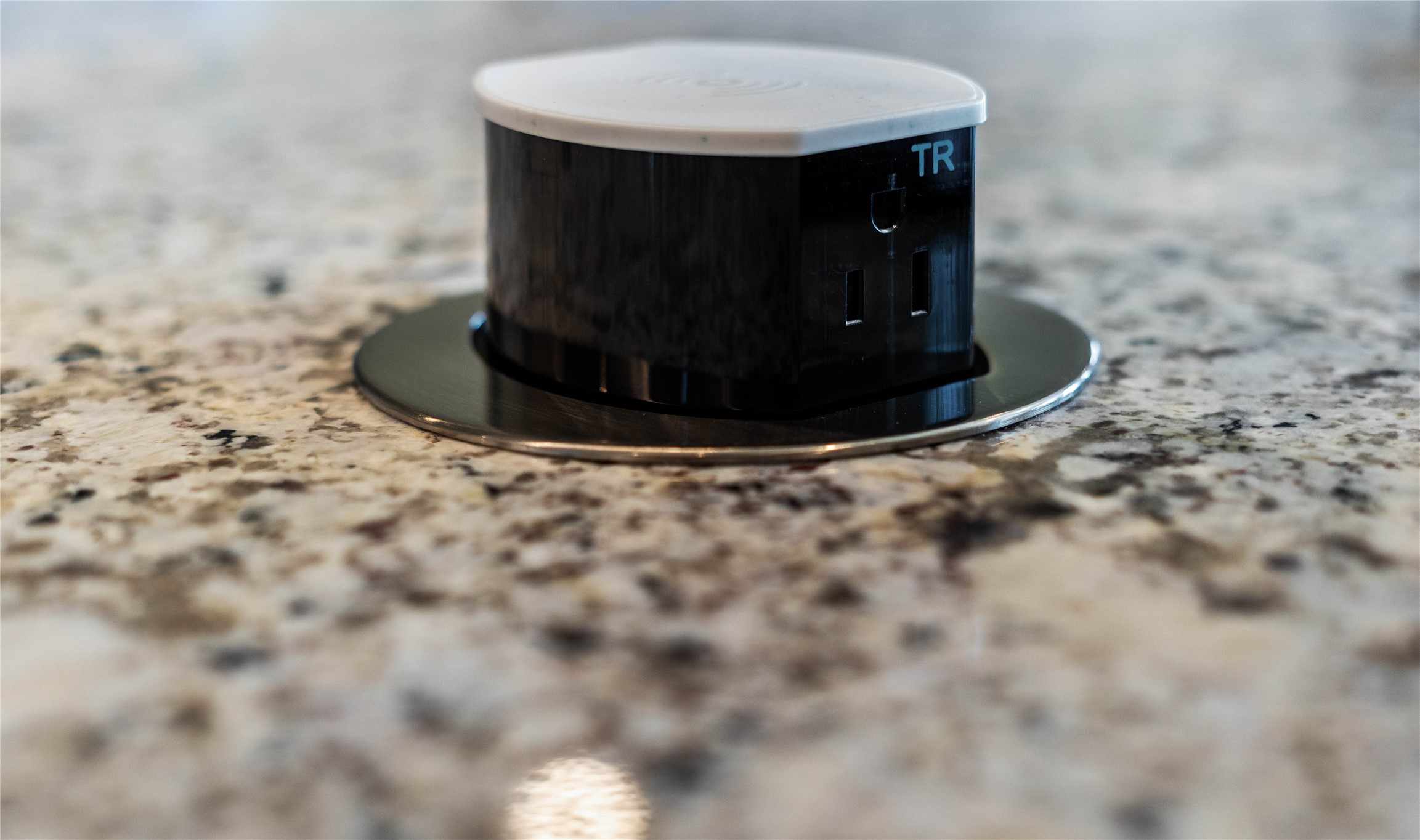 Experience the perfect blend of form and function with this sleek, hidden pop-up receptacle integrated directly into the kitchen island. This modern power solution offers instant access to electricity for appliances and mobile devices, then seamlessly disappears with a simple push to maintain a clean, uncluttered countertop aesthetic.