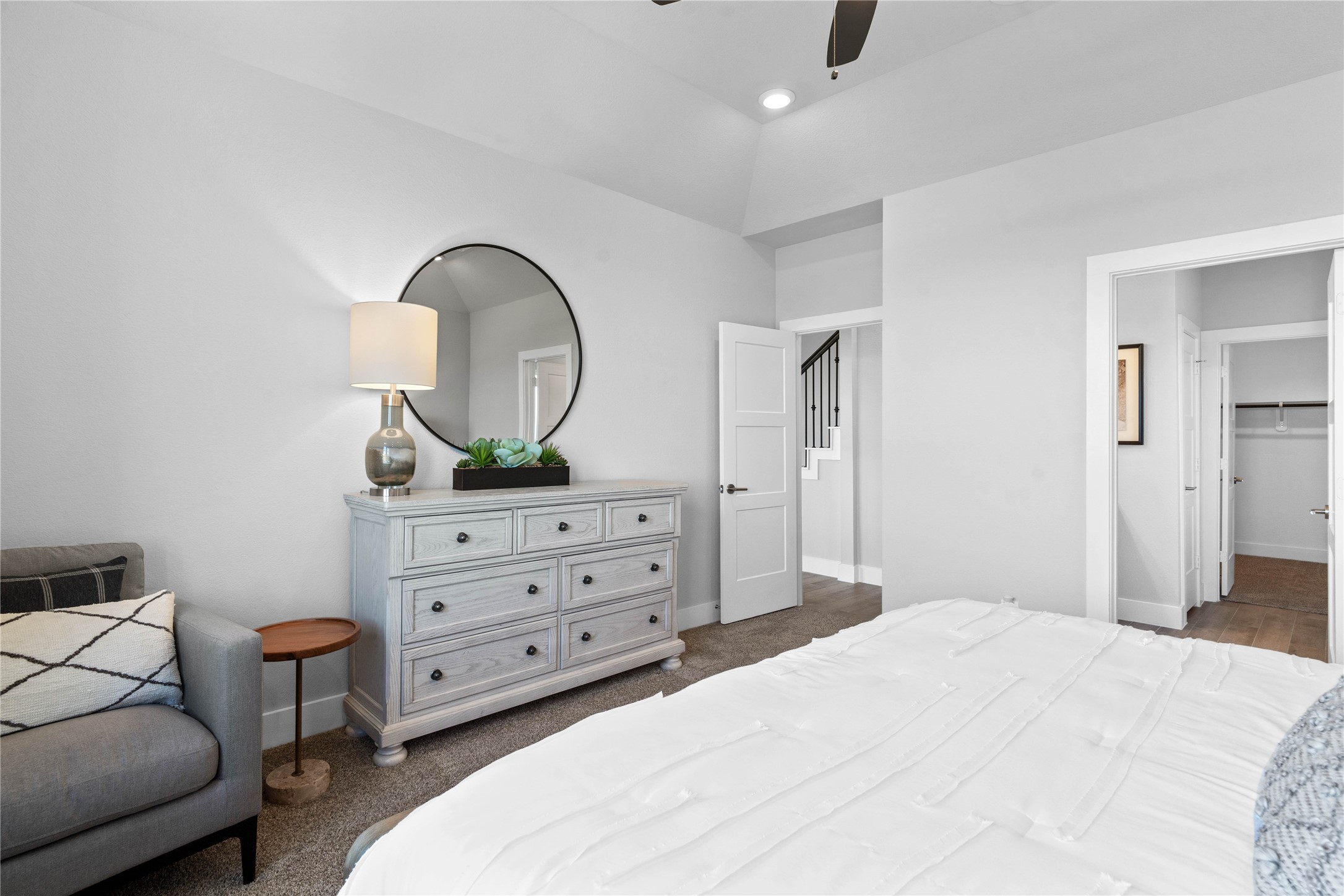 The private primary suite efficiently connects the sleeping area with the dedicated bathroom and generous closet.