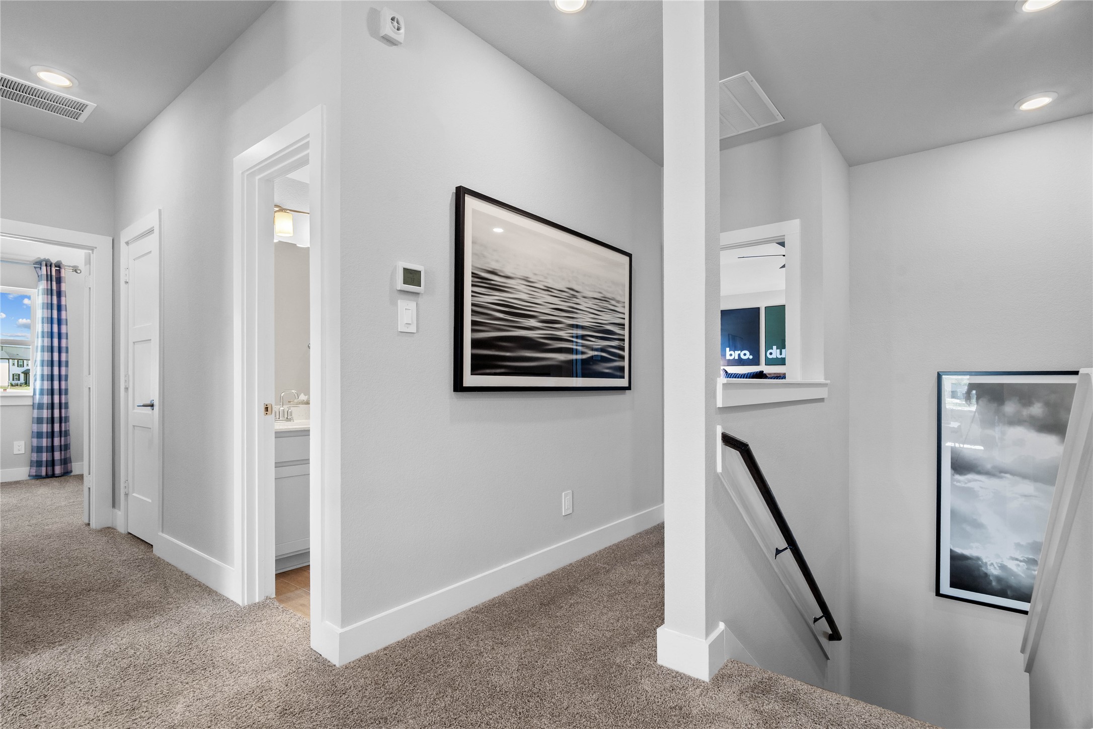 Additional view from Game Room to staircase and hallway leading to the secondary bedrooms and bathroom.
