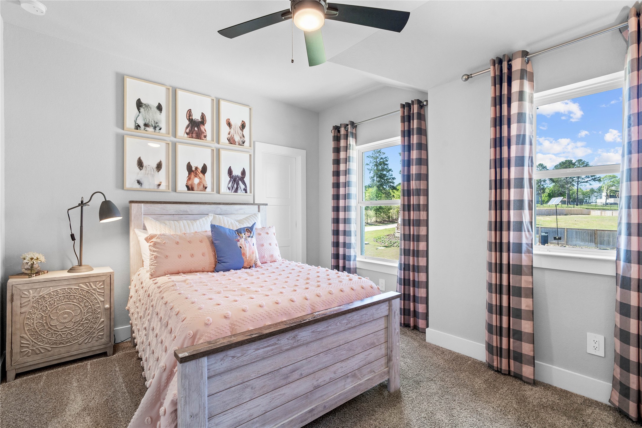 This room features soft plush carpeting, a window with fitted blinds, sloped ceiling, and a walk-in closet.