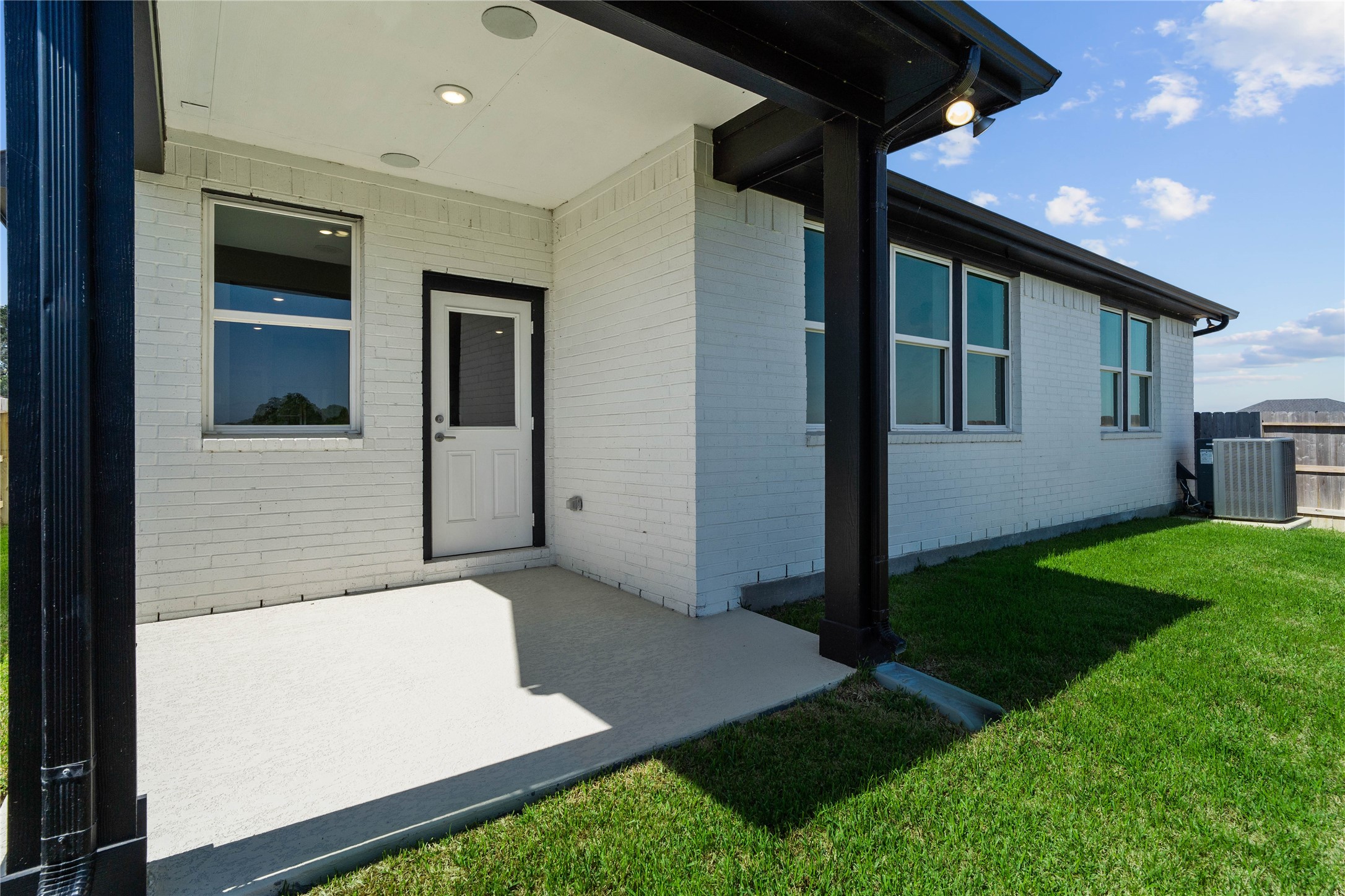 The spacious covered patio offers a tranquil outdoor retreat, perfectly designed for savoring your quiet morning coffee or unwinding during peaceful evening relaxation.
