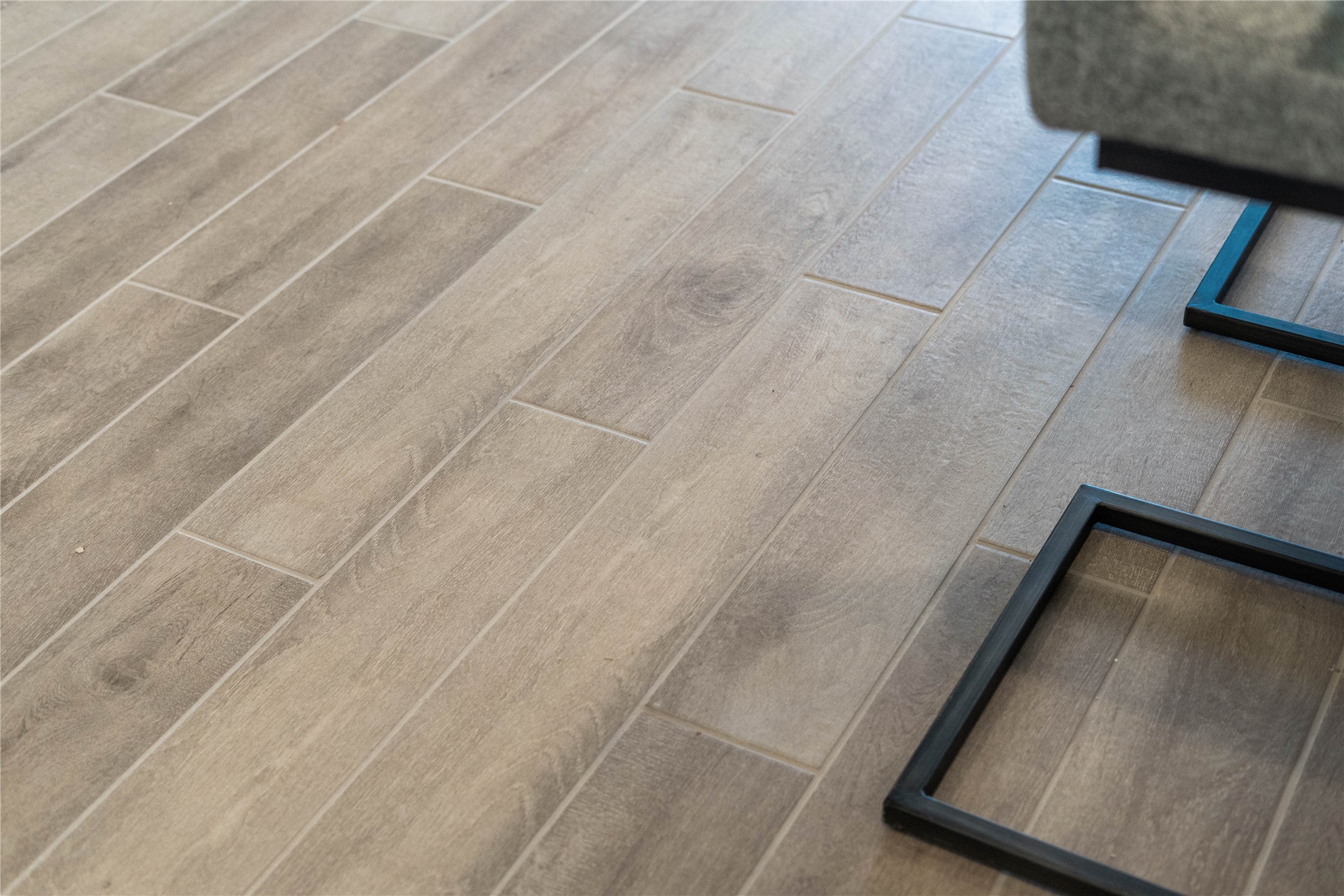 Gorgeous wood-look tile flooring in Natural occupies the main living areas of this gorgeous home.