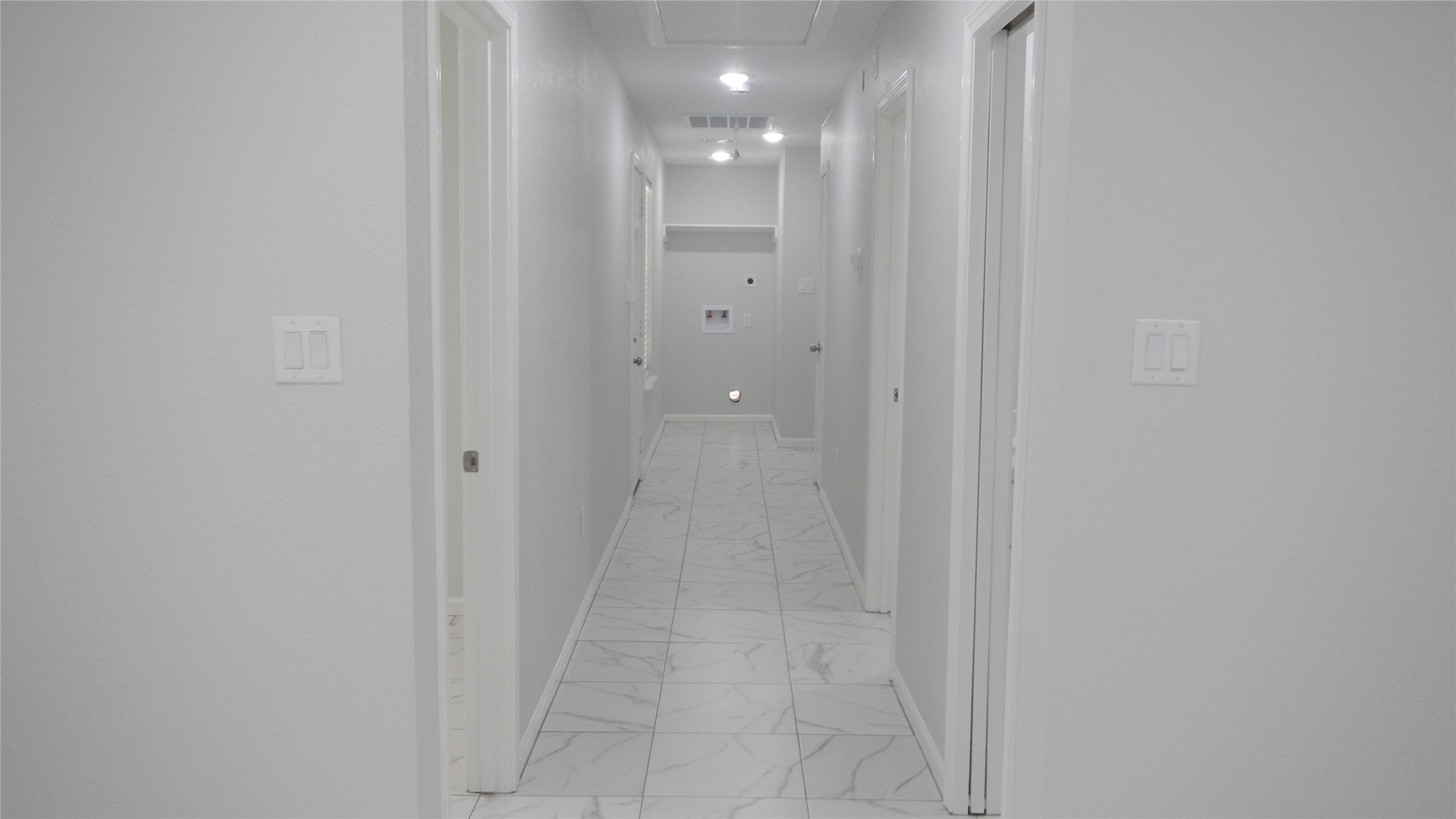 Recessed lights in hallway and second view of utility room