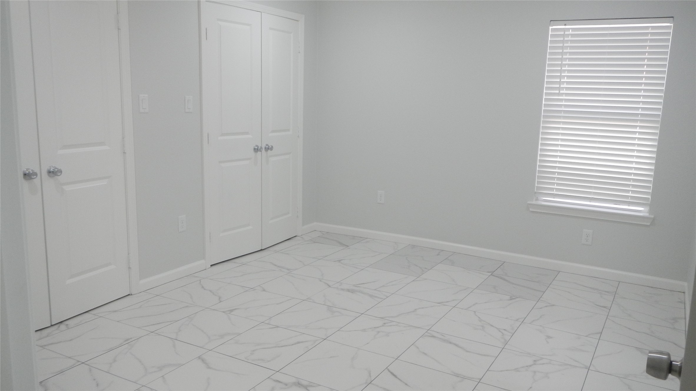 Primary bedroom with 2 walk in closets