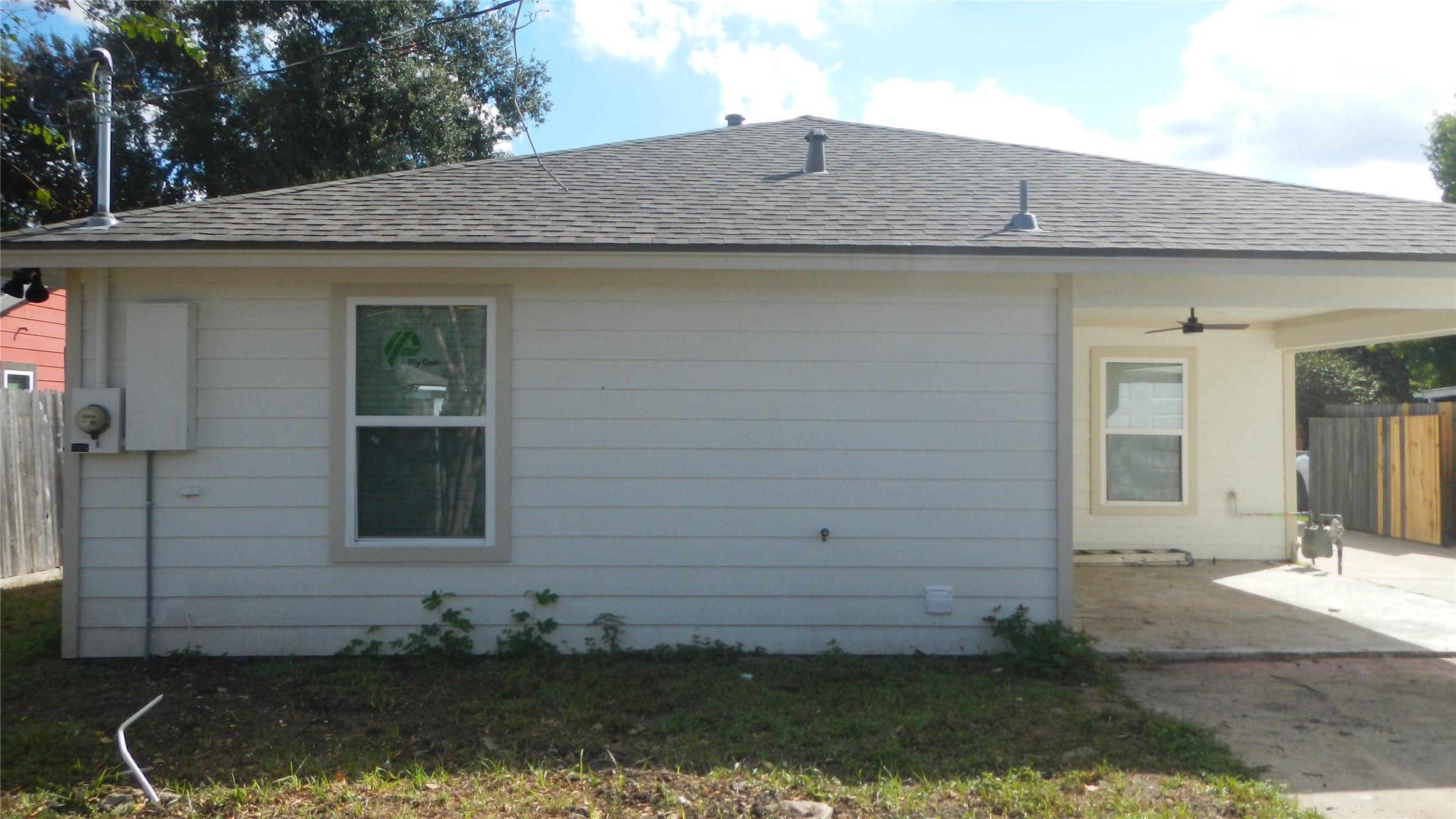 Rear view of home and covered patio