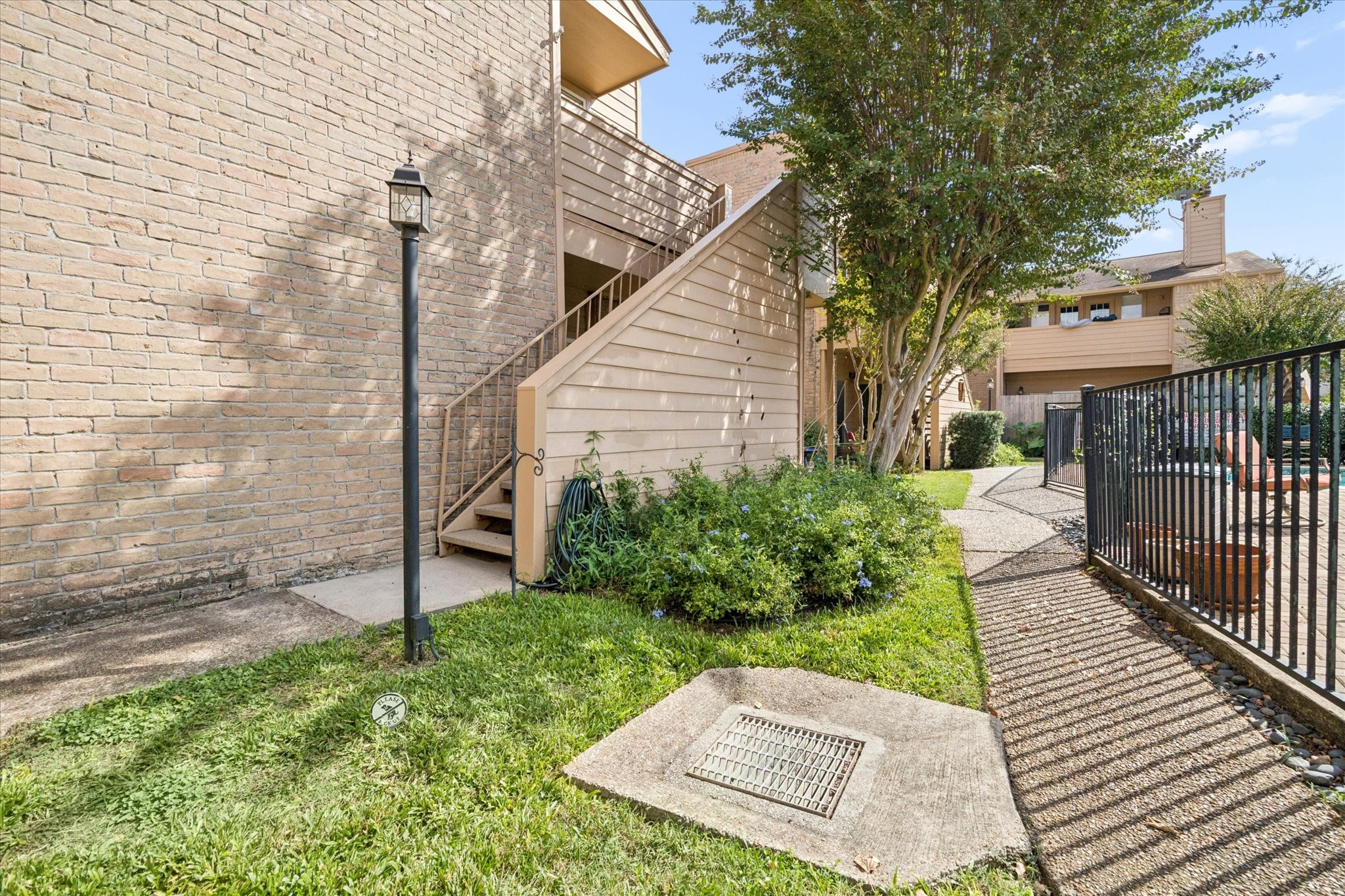 Second-floor unit with exterior stair access and a pleasant view overlooking the community pool and landscaped grounds. Second-floor unit with exterior stair access and a pleasant view overlooking the community pool and landscaped grounds.