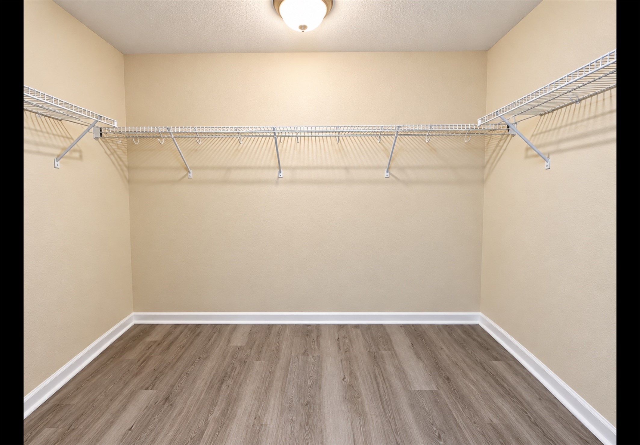 Spacious primary closet Spacious primary closet