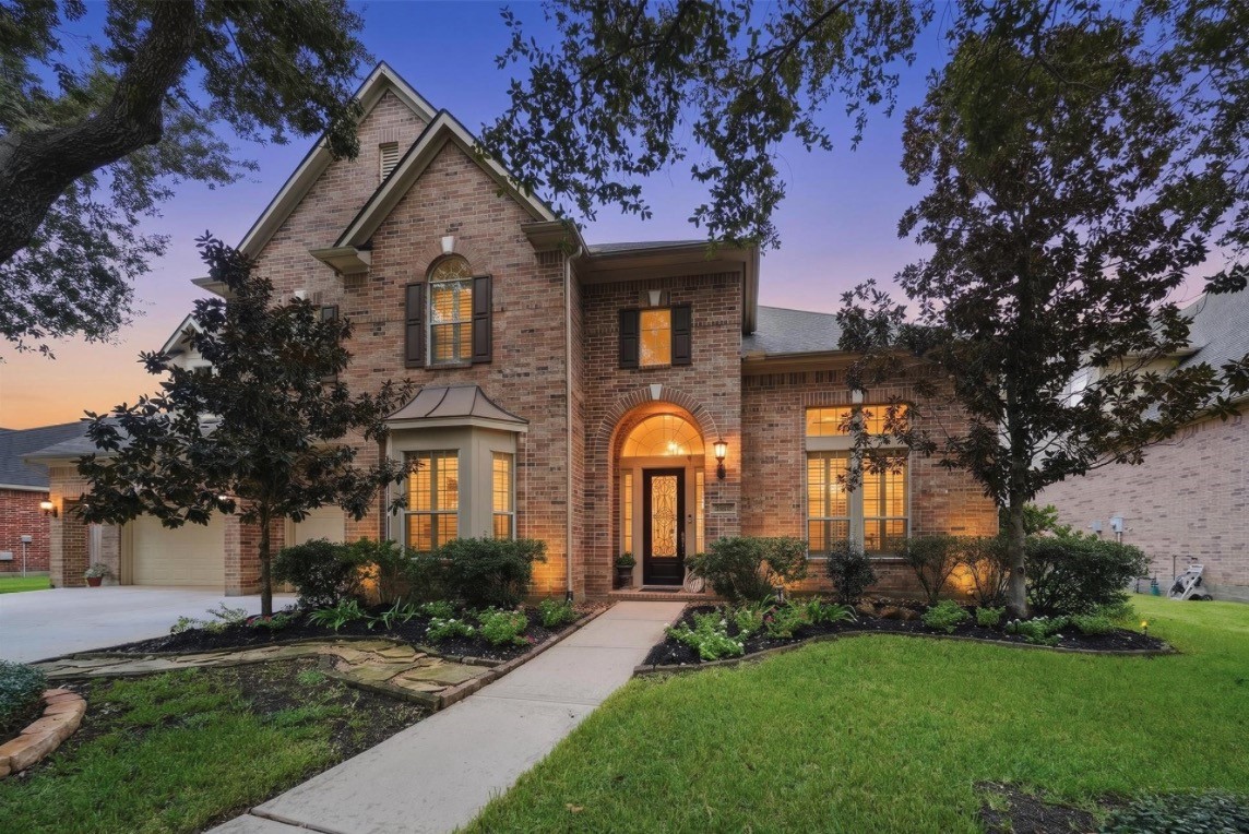 A stately Cinco Ranch residence offering more than 5,000 square feet, five bedrooms, 3.5 baths, an oversized three-car garage, and a private pool-and-spa retreat.