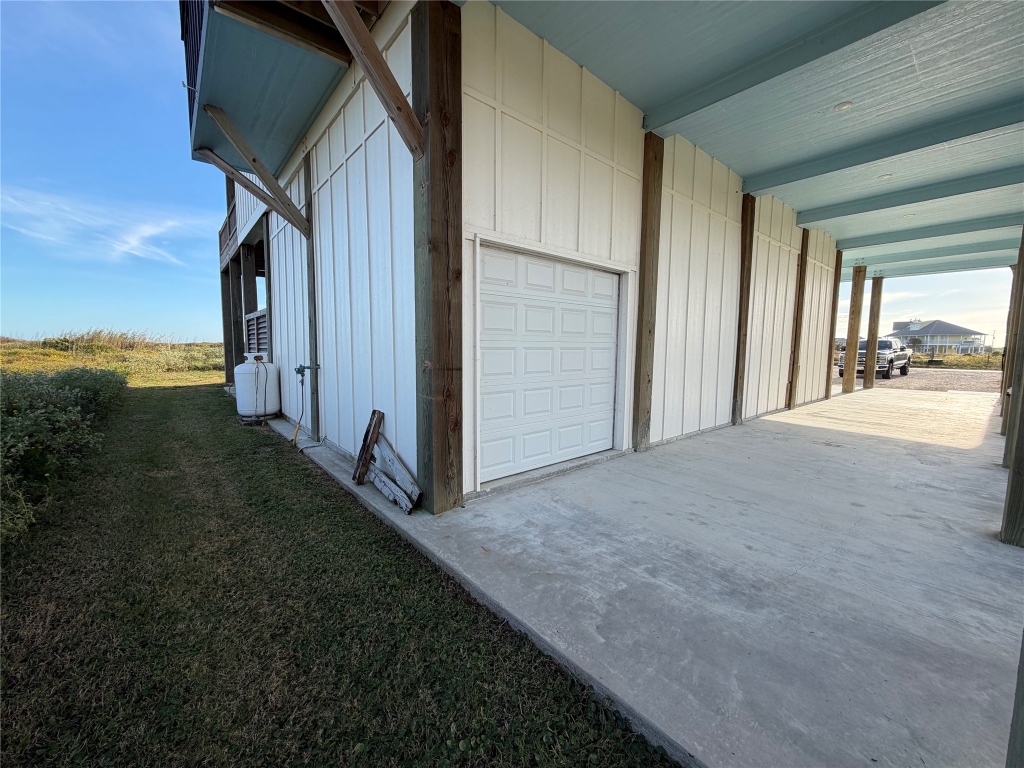 View from Northwest corner of garage with additional rollup door